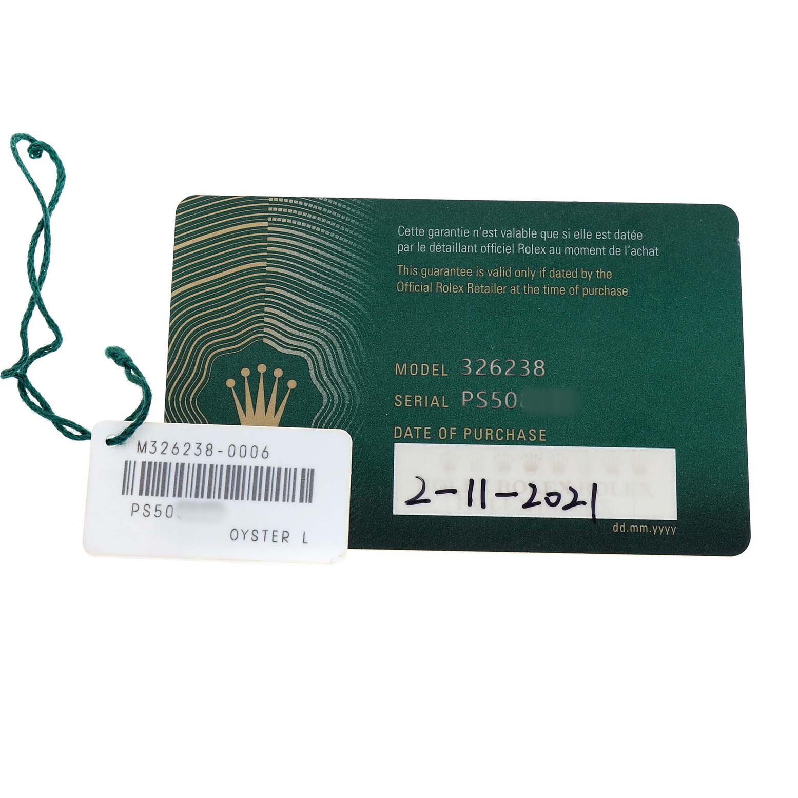 The image shows a Rolex Sky-Dweller 326238 Men's Yellow Gold White Dial warranty card with model, serial number, and purchase date, along with a green tag.