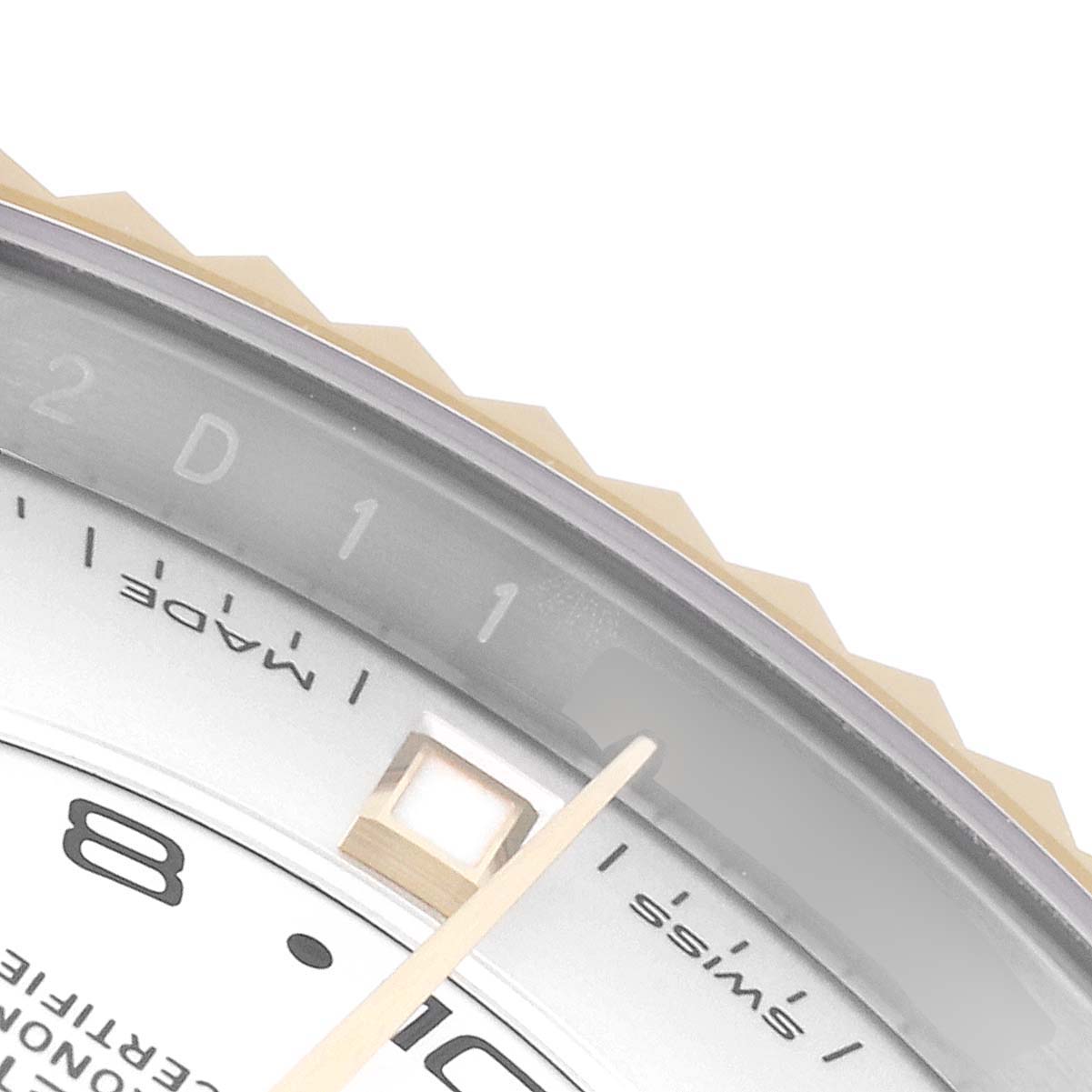 The image shows a close-up of the dial, bezel, and one of the hands of a Rolex Sky-Dweller 326933 Men's Steel and Gold (two tone) White Dial 326933 Men's Steel and Gold (two tone) White Dial watch.