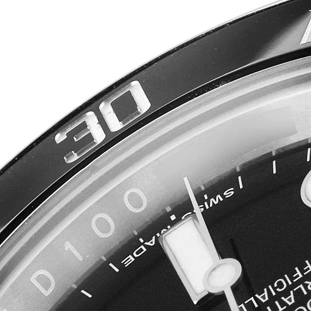 The image shows a close-up of the bezel, dial, and minute hand of a Rolex Submariner 116610LN Men
s Stainless Steel Black Dial 116610LN Men
s Stainless Steel Black Dial watch.