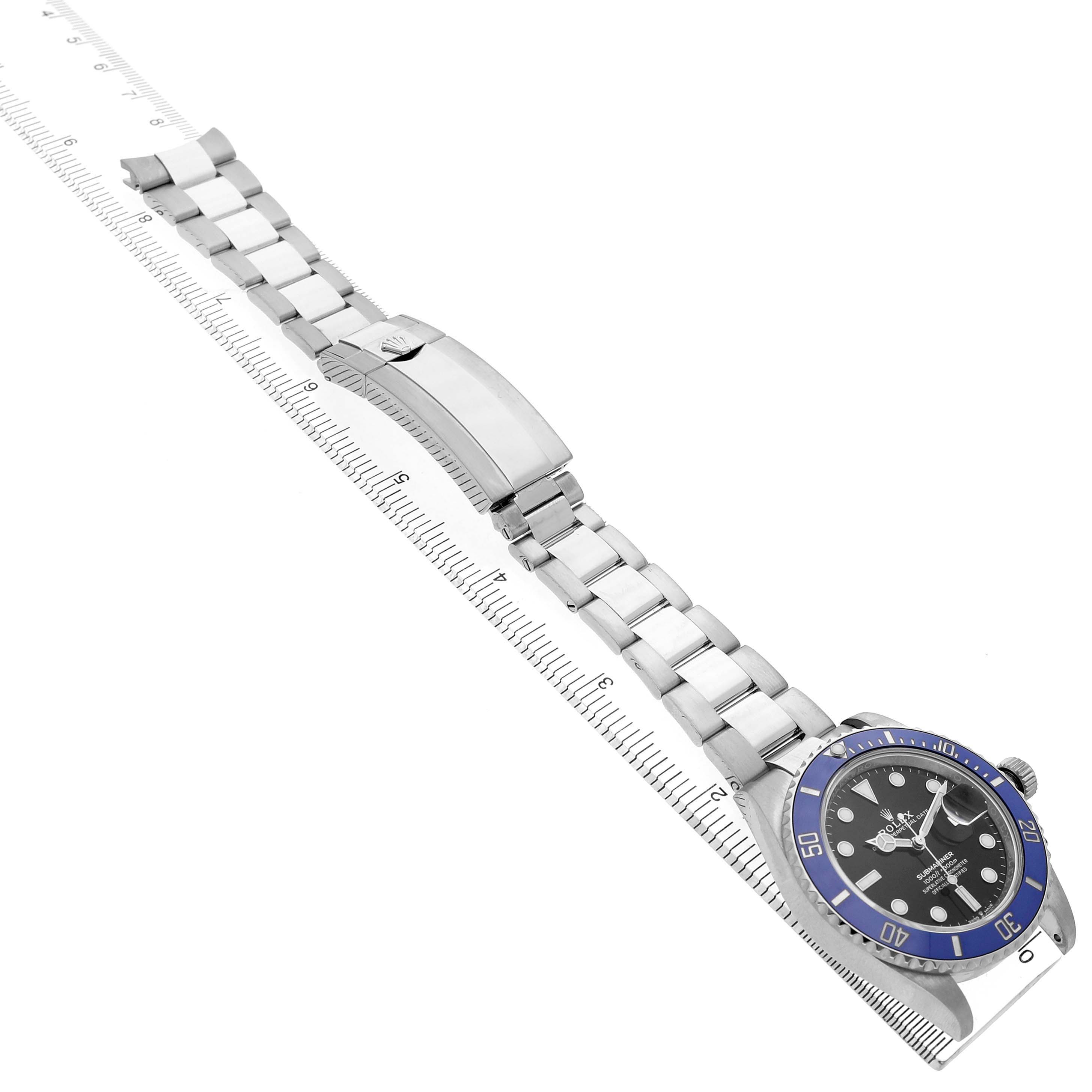 The Rolex Submariner 126619 Men's White Gold Black Dial watch is displayed at an angle showing the face, bezel, and bracelet with the clasp visible.