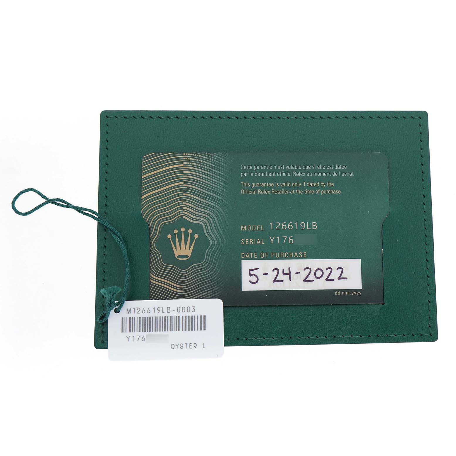 The image shows a green warranty card holder for a Rolex Submariner 126619 Men's White Gold Black Dial, displaying the model, serial number, and purchase date.