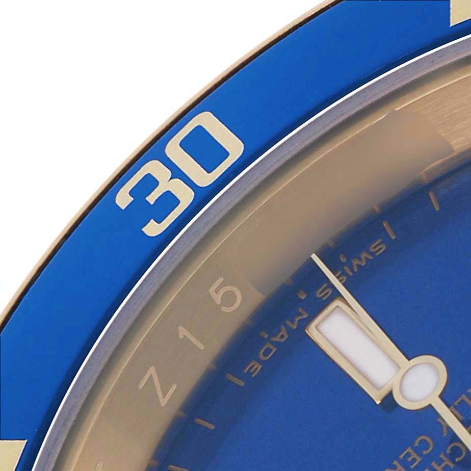 The image shows a close-up of the blue bezel and dial of a Rolex Submariner 16618 Men's Yellow Gold Blue Dial 16618 Men's Yellow Gold Blue Dial, highlighting the "30" mark and part of the minute hand.