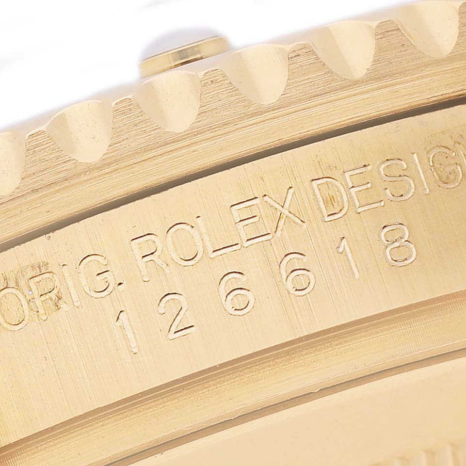 The image shows a close-up of the side engraving on a Rolex Submariner 126618LB Men's Yellow Gold Blue Dial model, highlighting the words "ORIG. ROLEX DESIGN" and the model number.