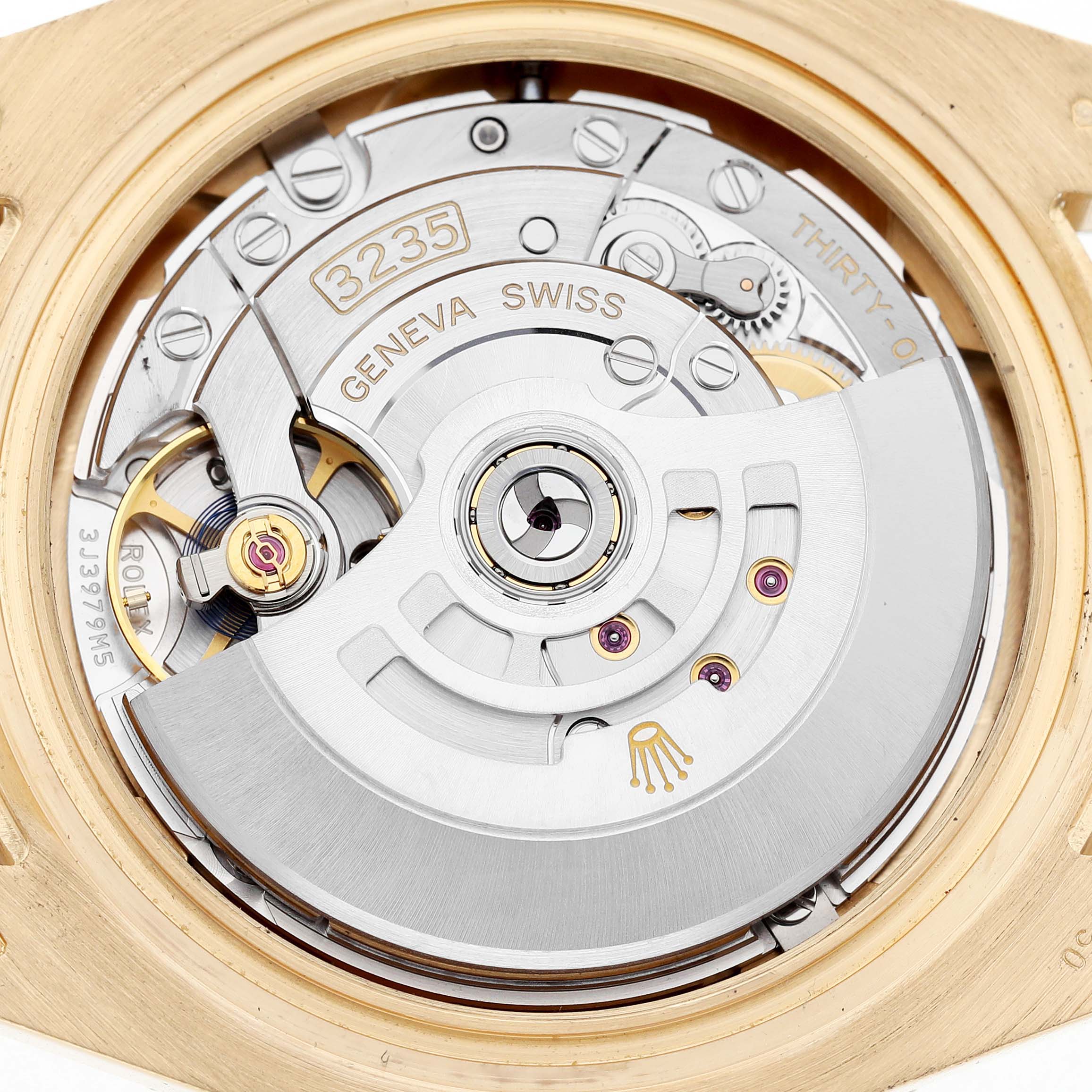 This image shows the movement of a Rolex Submariner 126618LB Men's Yellow Gold Blue Dial watch, highlighting the rotor and intricate inner mechanisms.