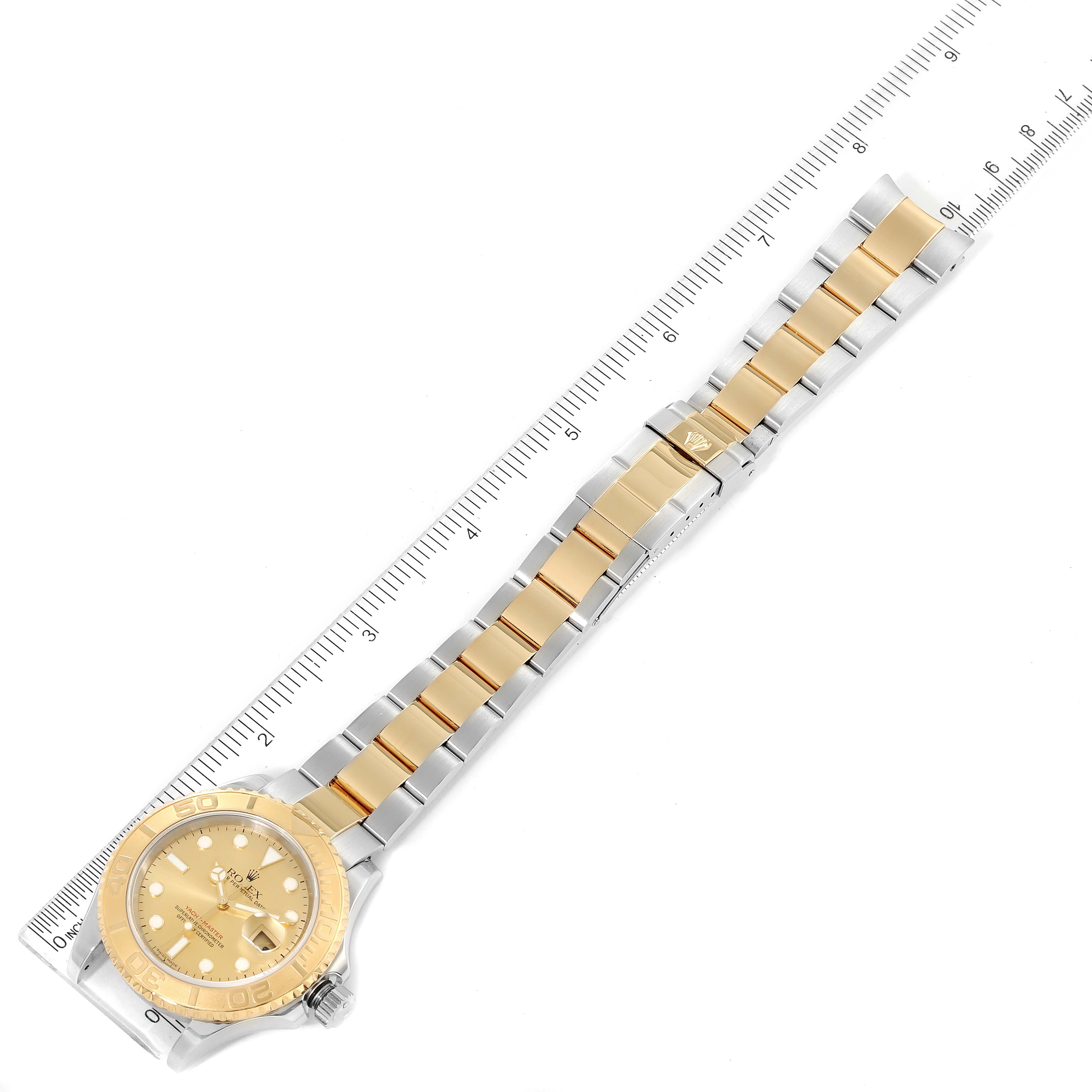 This image shows a top-down view of a Rolex Yacht-Master 16623 Men
s Steel and Gold (two tone) Champagne Dial 16623 Men
s Steel and Gold (two tone) Champagne Dial watch, including the face, bezel, and bracelet with a ruler for scale.