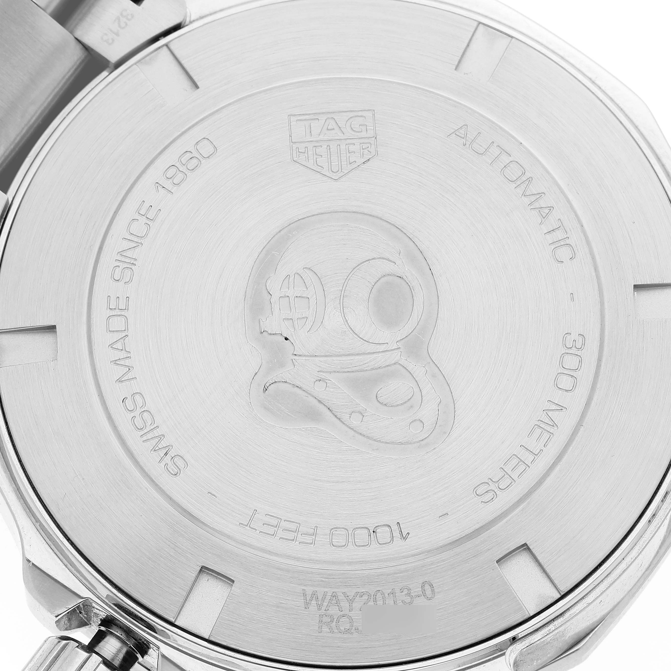 This image shows the case back of a Tag Heuer Aquaracer WAY2013.BA0927 Men's Stainless Steel White Dial WAY2013.BA0927 Men's Stainless Steel White Dial watch, highlighting its engraved details and branding.