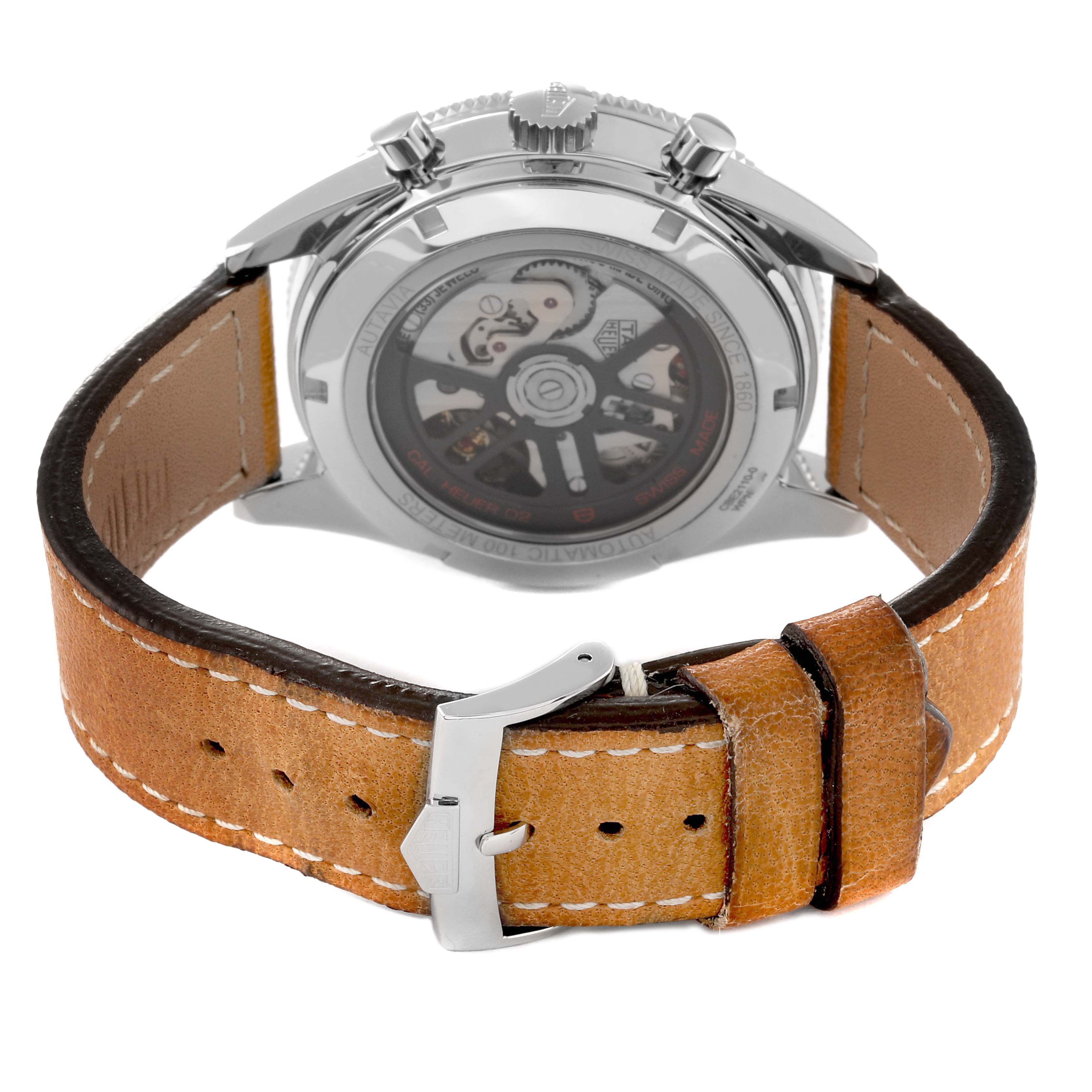 The image shows the back view of a Tag Heuer Autavia CBE2110 Men's Stainless Steel Black Dial CBE2110 Men's Stainless Steel Black Dial watch, focusing on its brown leather strap and exposed mechanical movement.