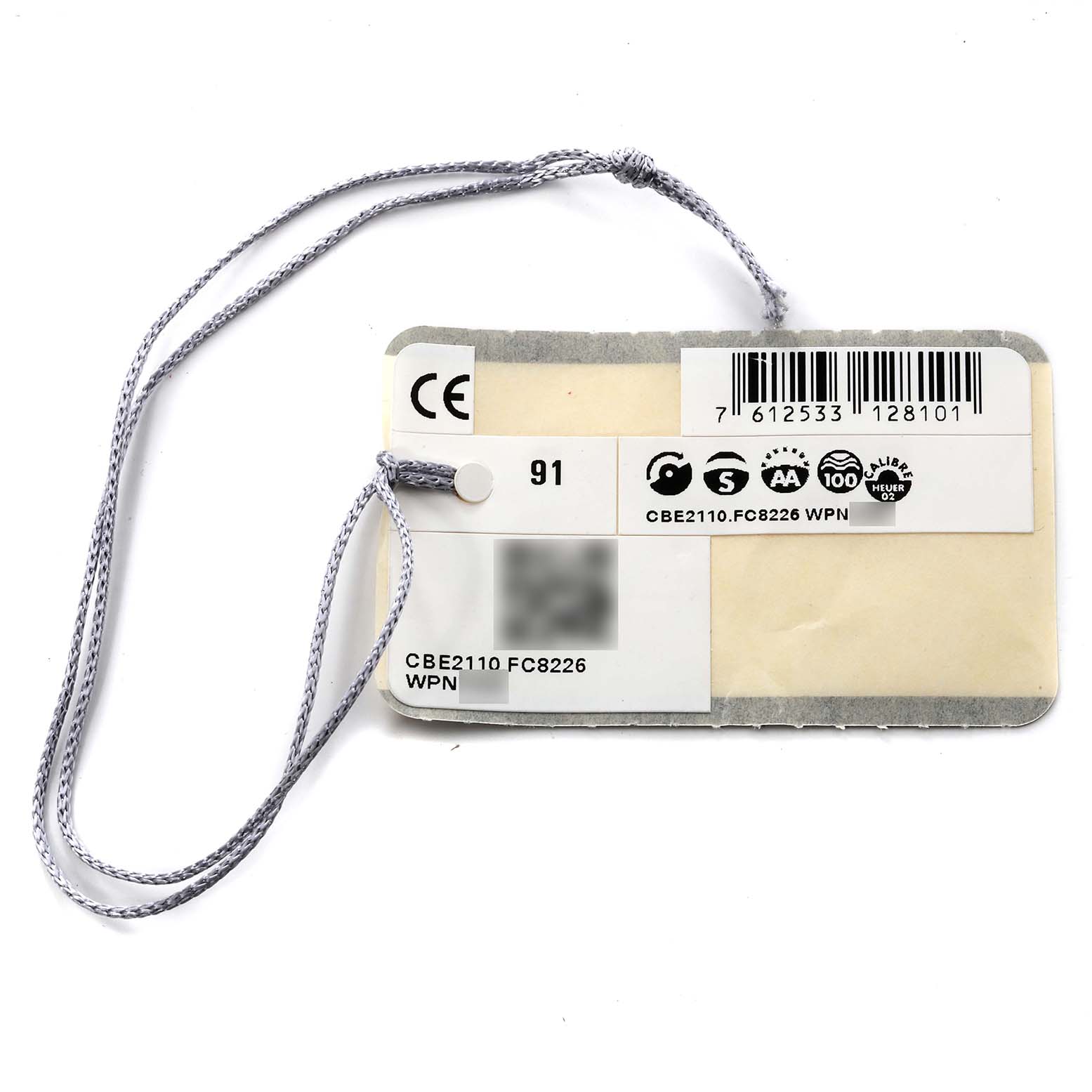 This is a close-up of a Tag Heuer Autavia CBE2110 Men's Stainless Steel Black Dial CBE2110 Men's Stainless Steel Black Dial model CBE2110.FC8226 watch tag with a string and product details.