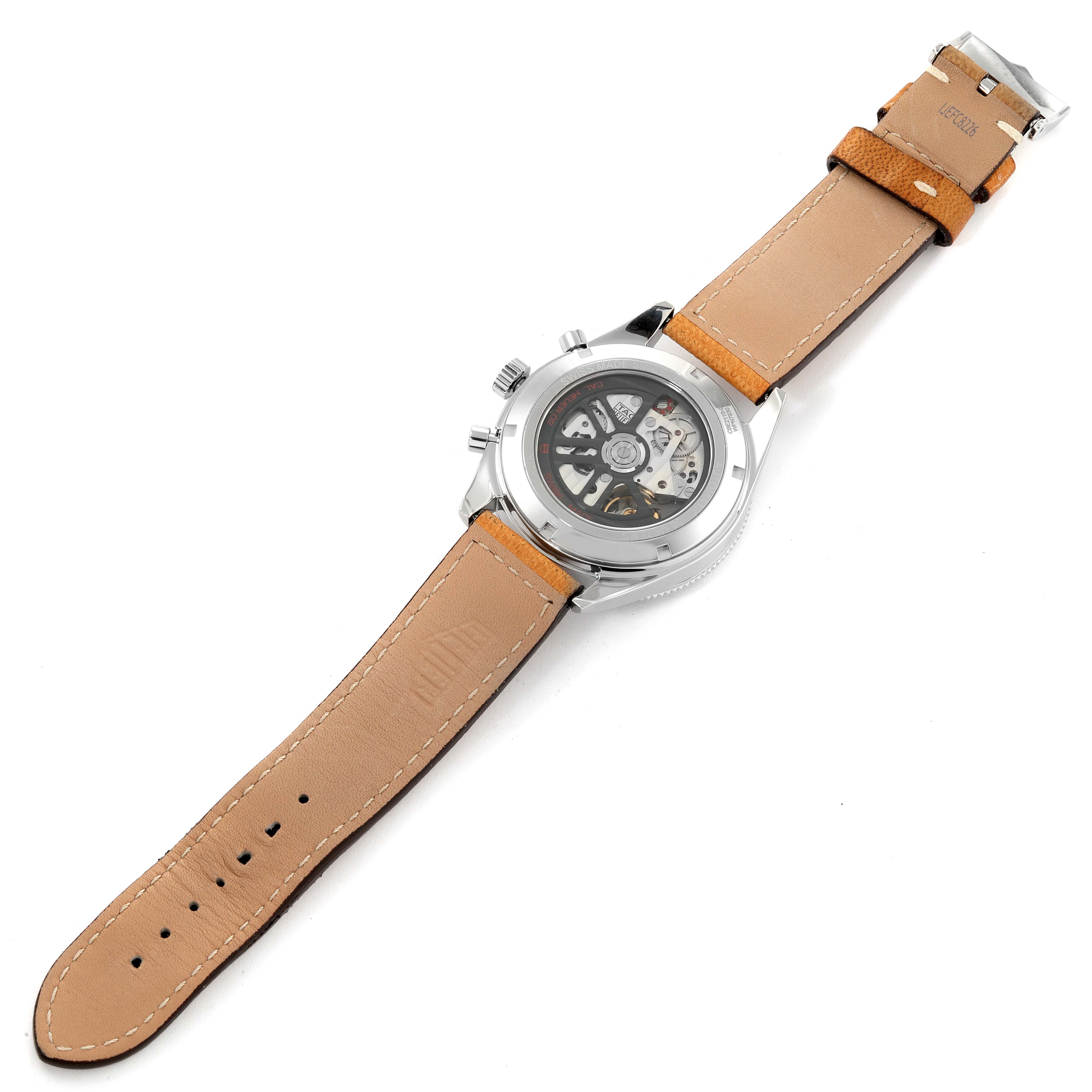 The image shows the back view of a Tag Heuer Autavia CBE2110 Men's Stainless Steel Black Dial CBE2110 Men's Stainless Steel Black Dial watch, highlighting its skeleton case back and leather strap.