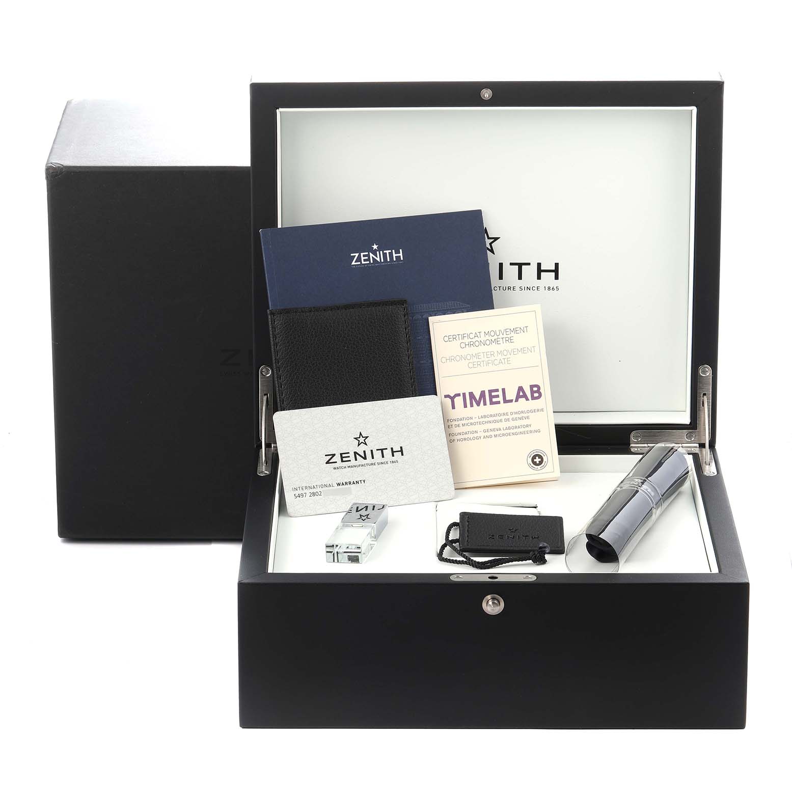 The image shows the packaging and accessories for the Zenith Defy 49.9000.9004/78.R782 Men
s Ceramic Transparent Dial 49.9000.9004/78.R782 Men
s Ceramic Transparent Dial model, including documentation and a storage box.