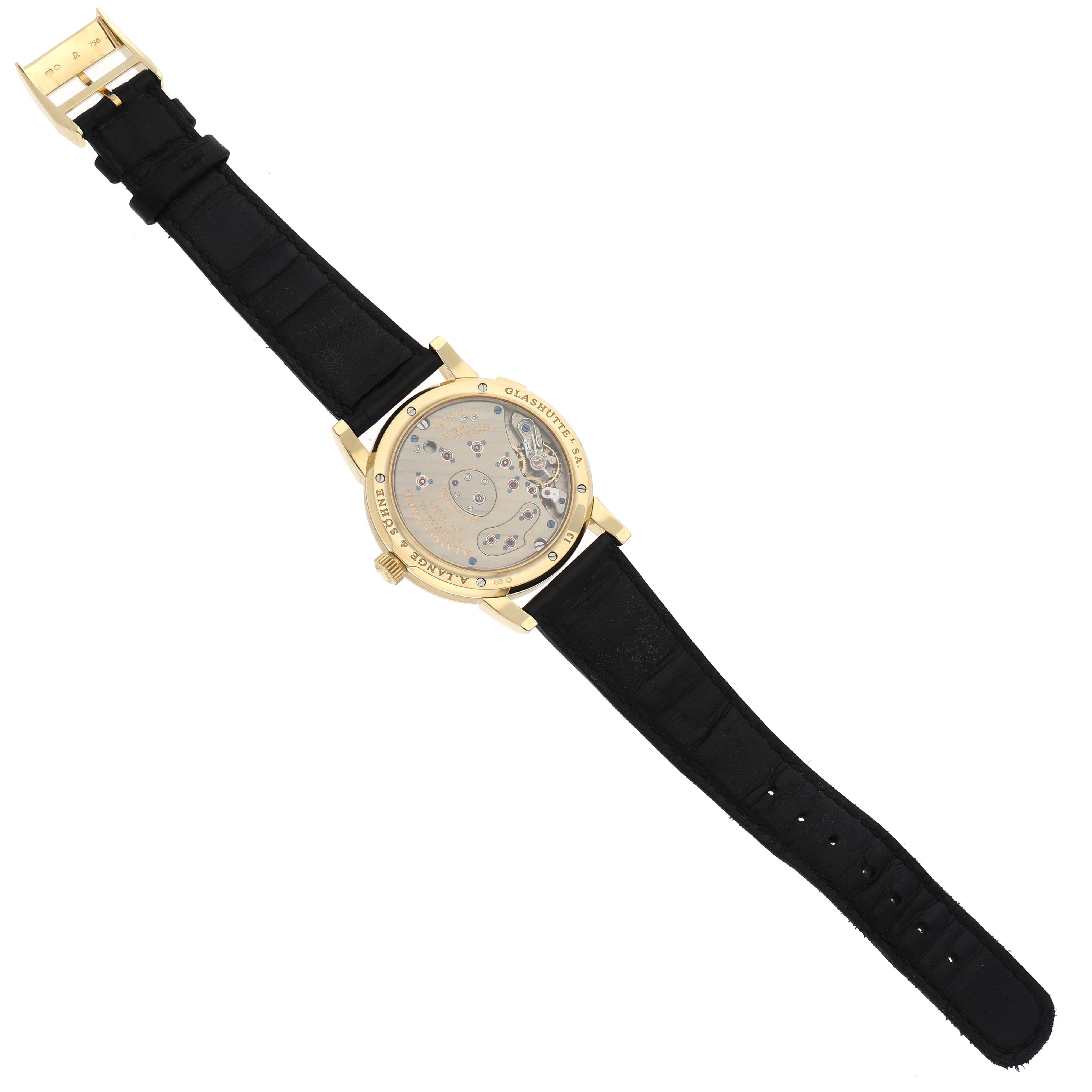 The image shows the back view of the A. Lange & Sohne Lange 1 watch, highlighting the movement and black strap.