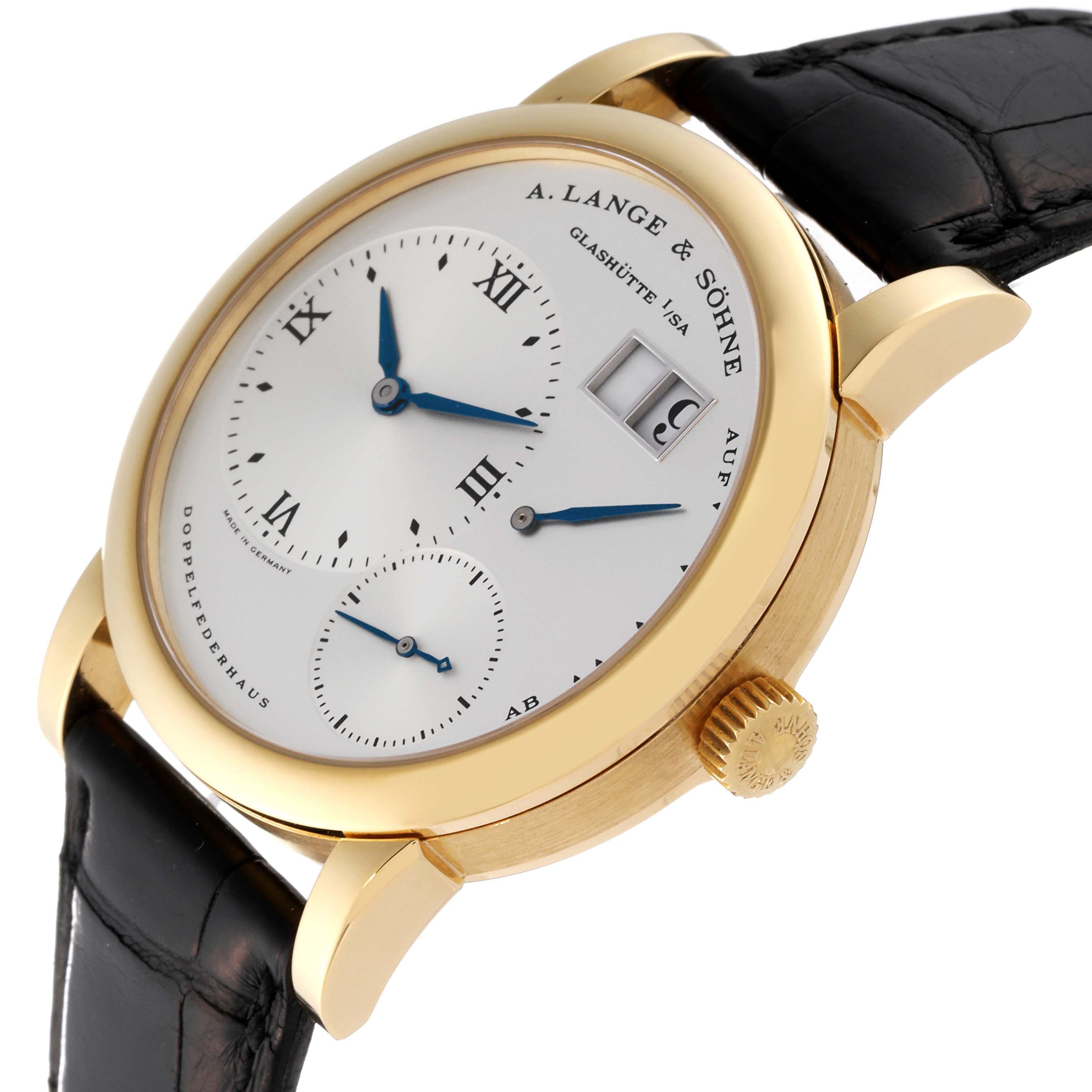 The image shows a close-up angle of the Lange 1 watch by A. Lange & Söhne, highlighting its gold case, white dial, and black leather strap.