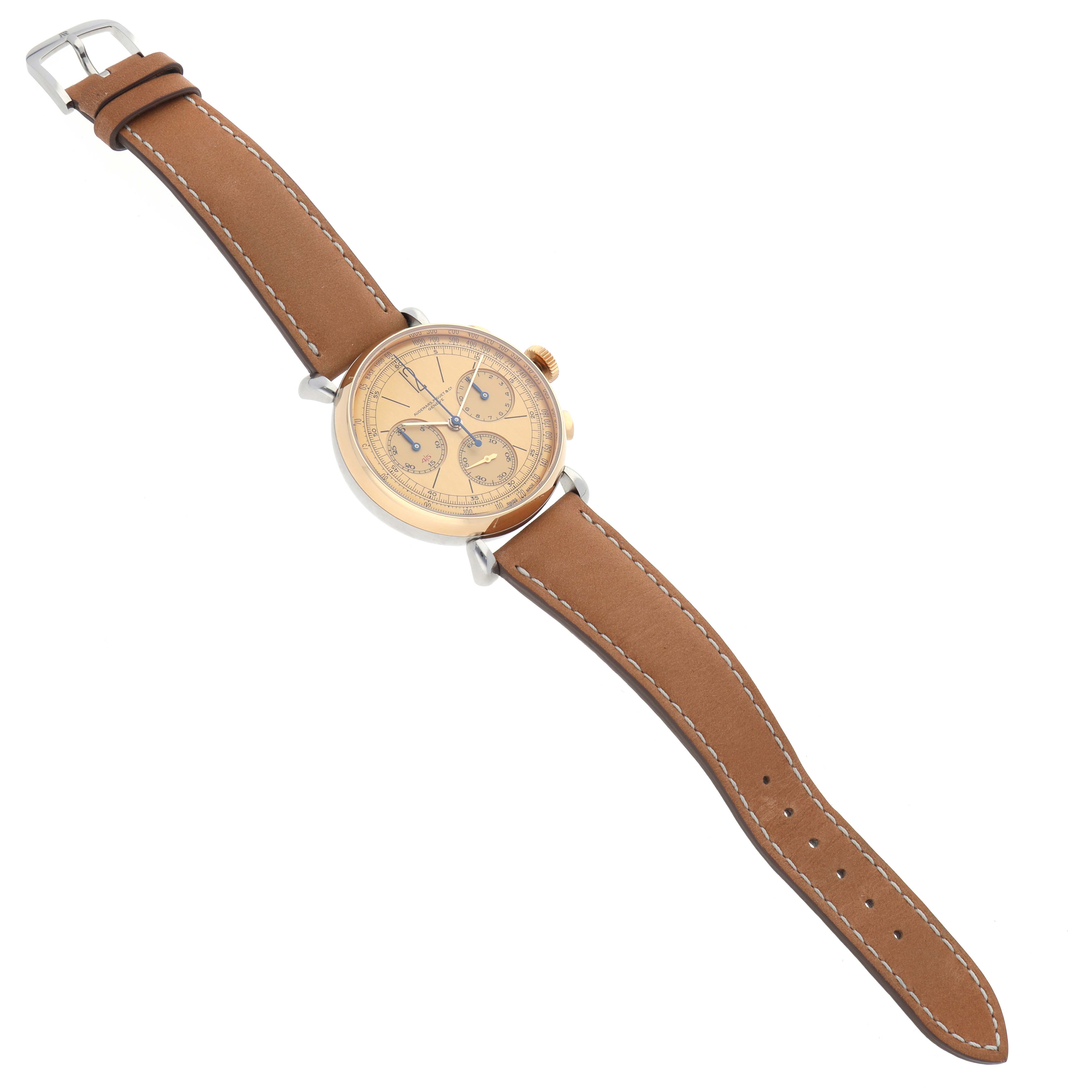 The Audemars Piguet Remaster  26595SR.OO.A032VE.01 Men
s Steel and Gold (two tone) Champagne Dial 26595SR.OO.A032VE.01 Men
s Steel and Gold (two tone) Champagne Dialwatch is shown from a top-down angle, displaying the dial, brown strap, and buckle.