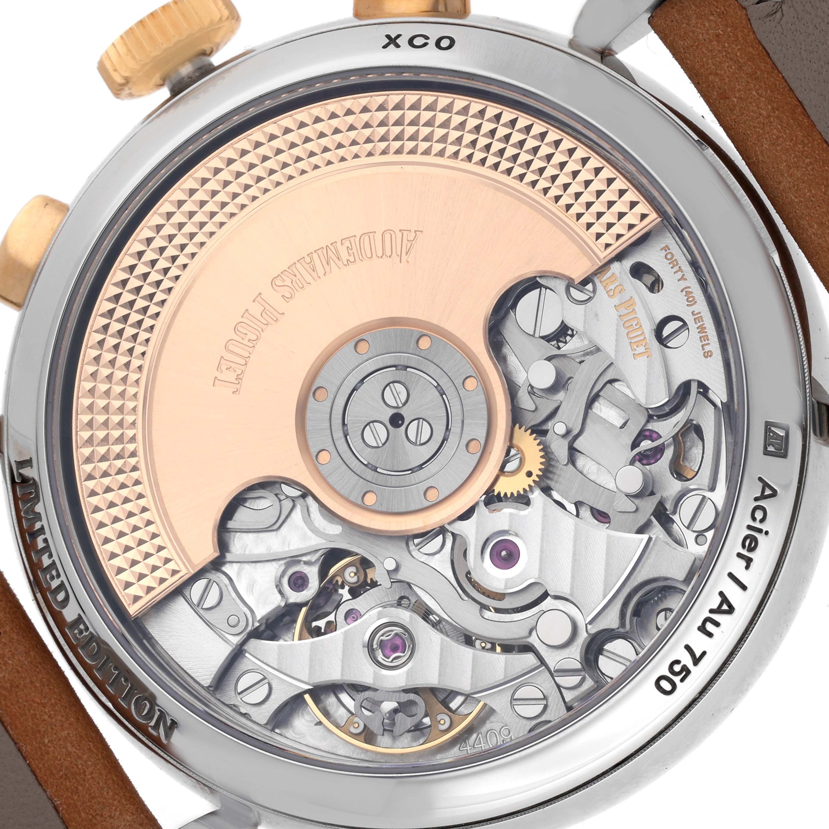 The image shows the back view of an Audemars Piguet Remaster  26595SR.OO.A032VE.01 Men
s Steel and Gold (two tone) Champagne Dial 26595SR.OO.A032VE.01 Men
s Steel and Gold (two tone) Champagne Dialwatch, highlighting its intricate movement and gold rotor.