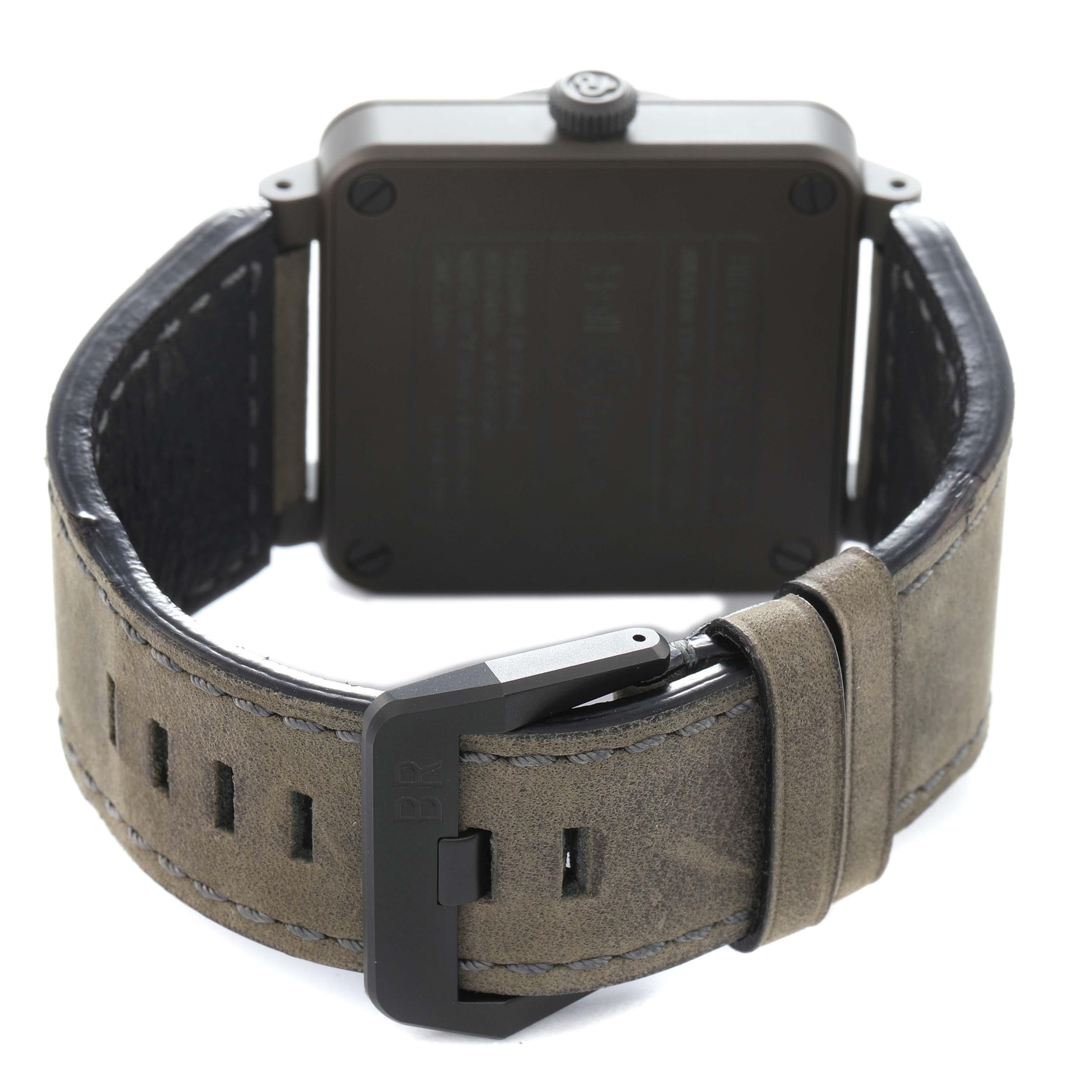 The image shows the Bell 
Ross Heritage BR03-92-CKA Men
s Ceramic Brown Dial BR03-92-CKA Men
s Ceramic Brown Dial watch from the back, highlighting the strap, buckle, and case back.