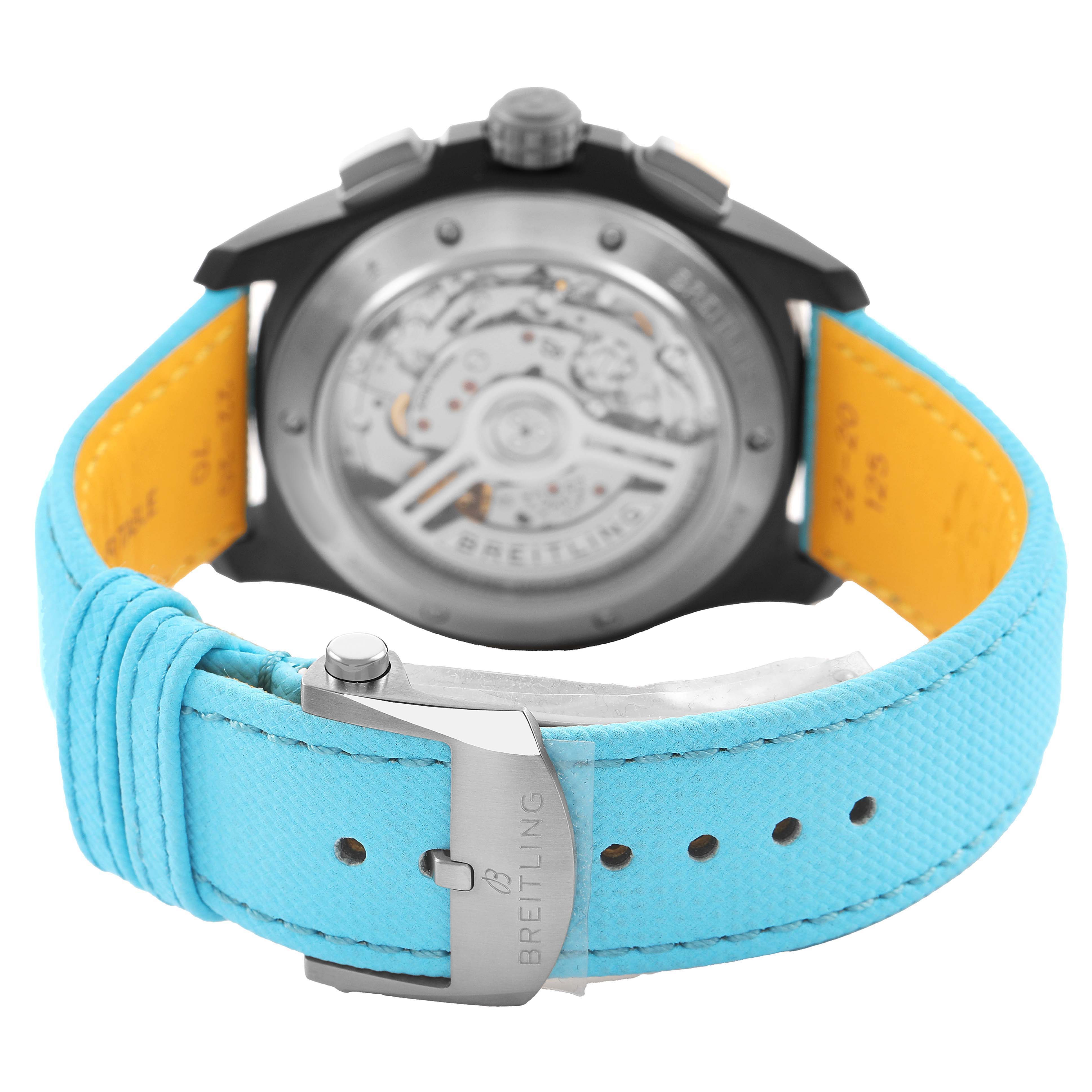 The Breitling Avenger SB0146 Men's Ceramic Blue Dial watch is shown from the back, highlighting the open case back and aqua strap with a metal buckle.