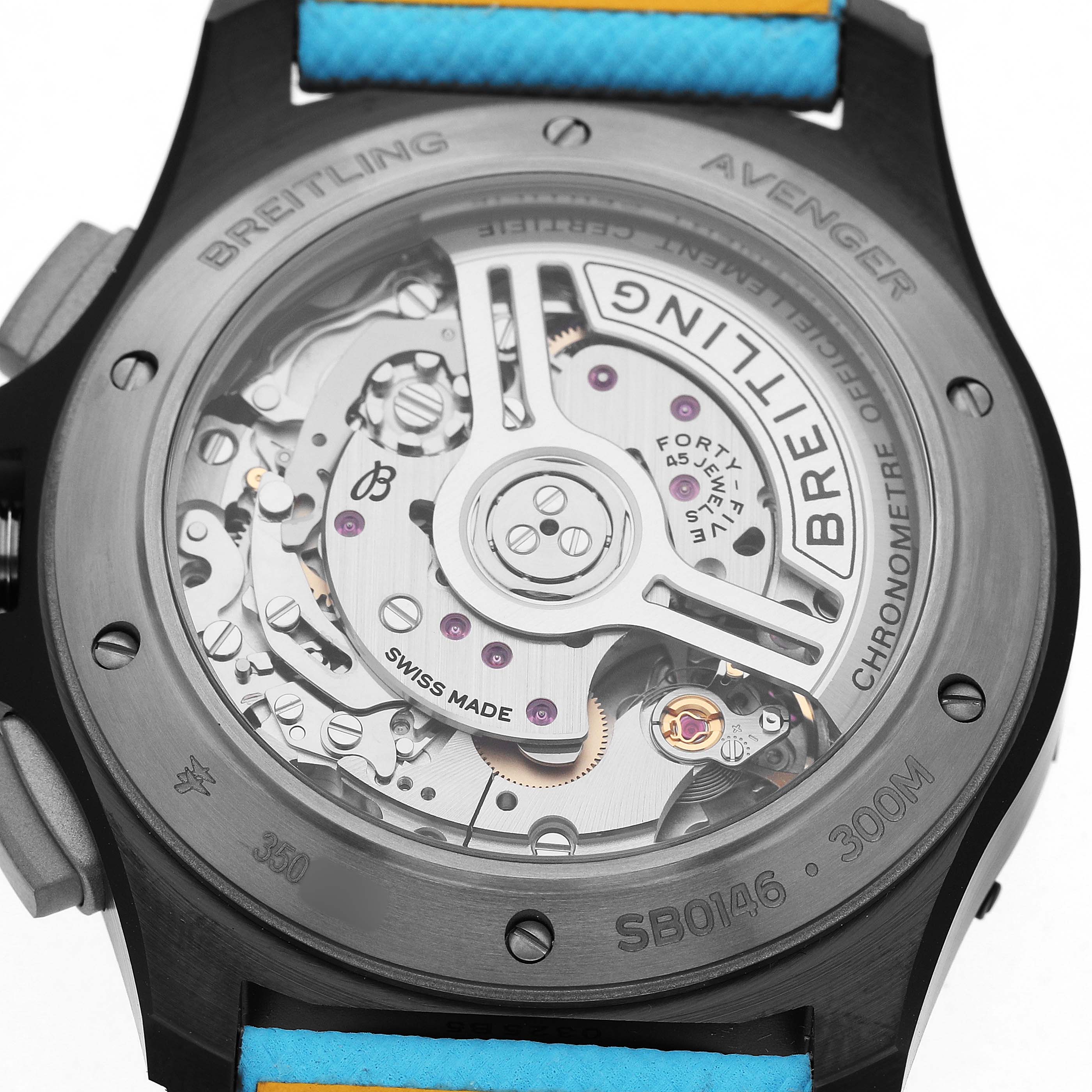The image shows the back of a Breitling Avenger SB0146 Men's Ceramic Blue Dial watch, highlighting its movement and an open case back with visible components.