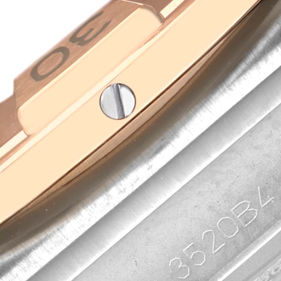 The image shows a close-up of the bezel and case side of the Breitling Chronomat UB0134101C1U1 Men's Steel and Gold (two tone) Blue Dial UB0134101C1U1 Men's Steel and Gold (two tone) Blue Dial watch.