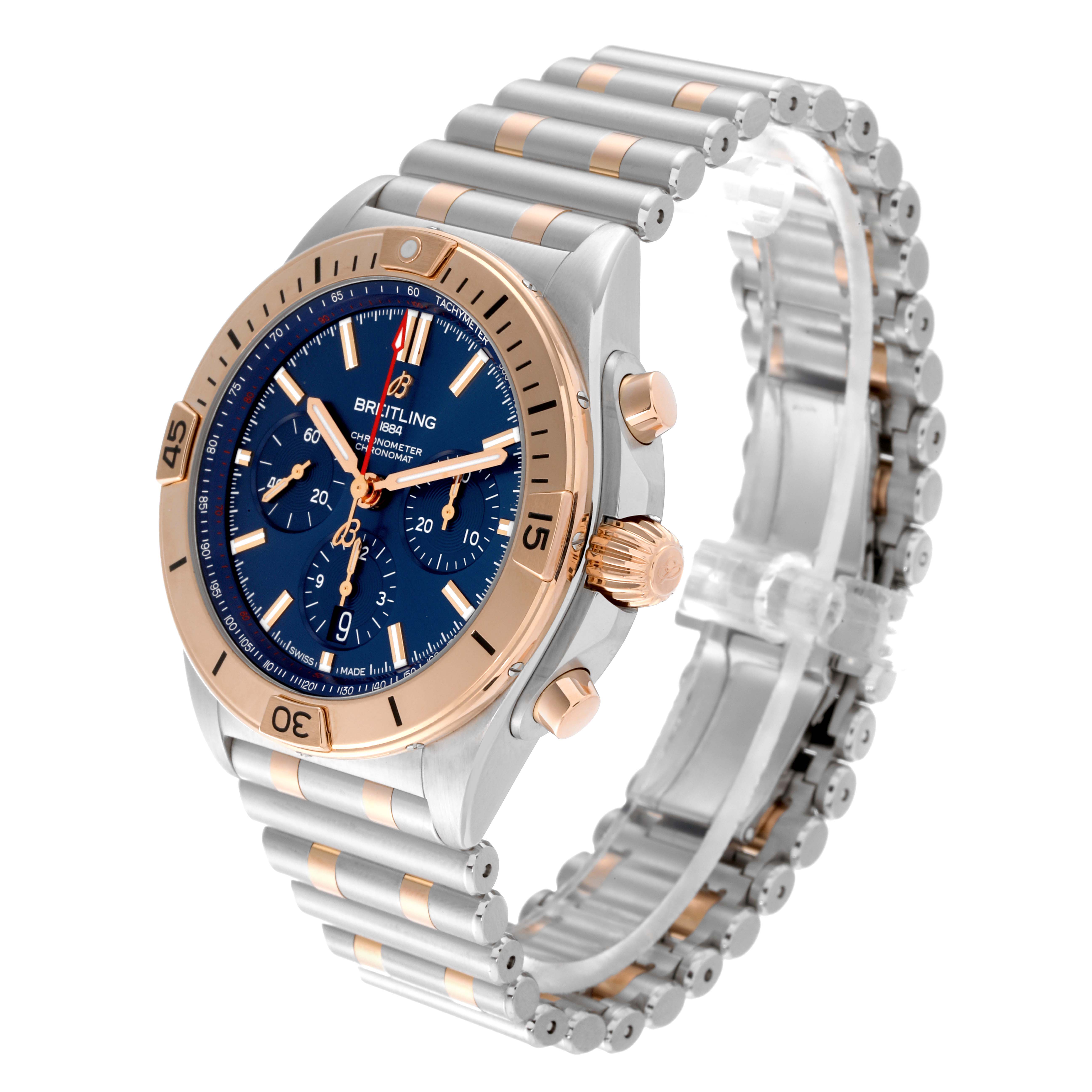 The Breitling Chronomat UB0134101C1U1 Men's Steel and Gold (two tone) Blue Dial UB0134101C1U1 Men's Steel and Gold (two tone) Blue Dial watch is shown at an angled perspective, displaying its dial, bezel, crown, pushers, and bracelet.