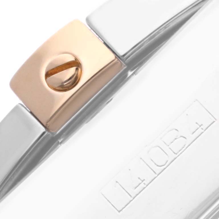 This close-up image shows the strap and clasp of a Breitling Chronomat IB0110 Men's Stainless Steel White Dial IB0110 Men's Stainless Steel White Dial watch, highlighting the screw detail and a portion of the engraved serial number.