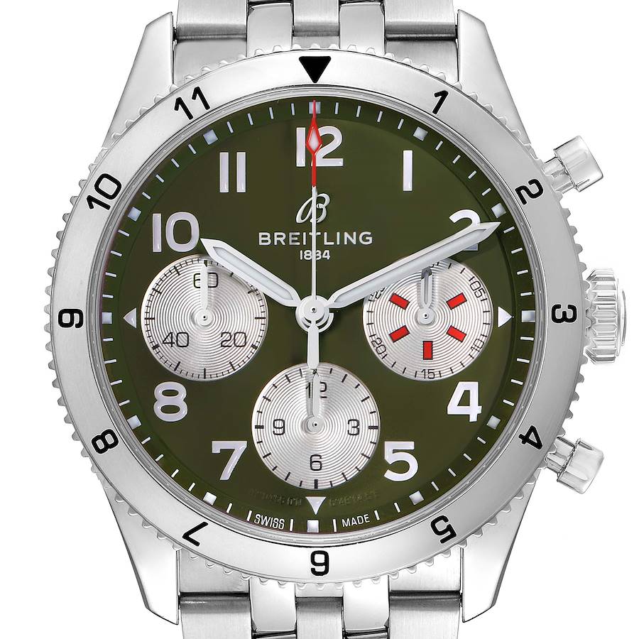 The Breitling Aviator watch is shown from a top-down angle, displaying the face, bezel, crown, and part of the bracelet.