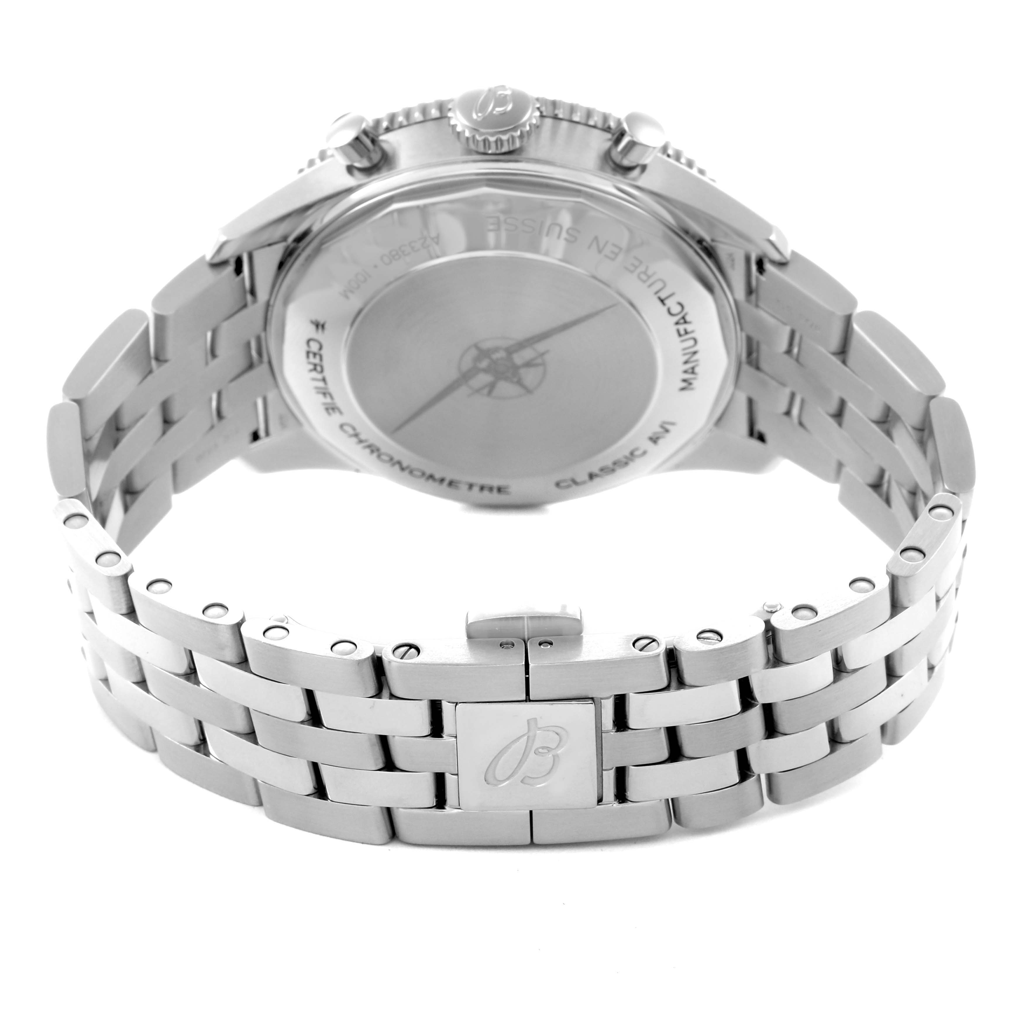 The image shows the backside of a Breitling Aviator A23380 Men
s Stainless Steel Green Dial A23380 Men
s Stainless Steel Green Dial watch, focusing on the case back and metal bracelet.