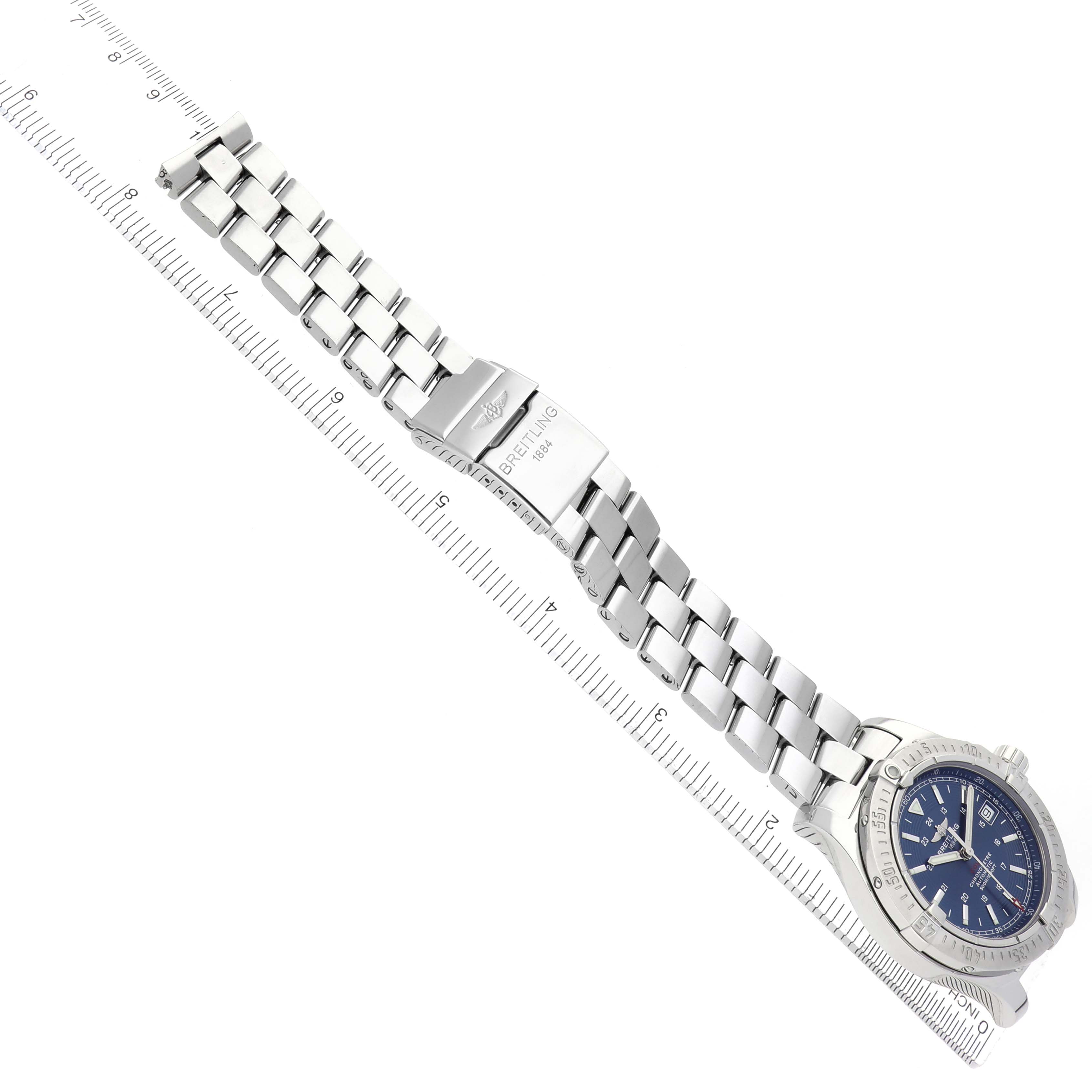 The image shows a Breitling Colt A17380 Men
s Stainless Steel Blue Dial A17380 Men
s Stainless Steel Blue Dial watch at a diagonal angle with its bracelet fully extended, showcasing the clasp and face.