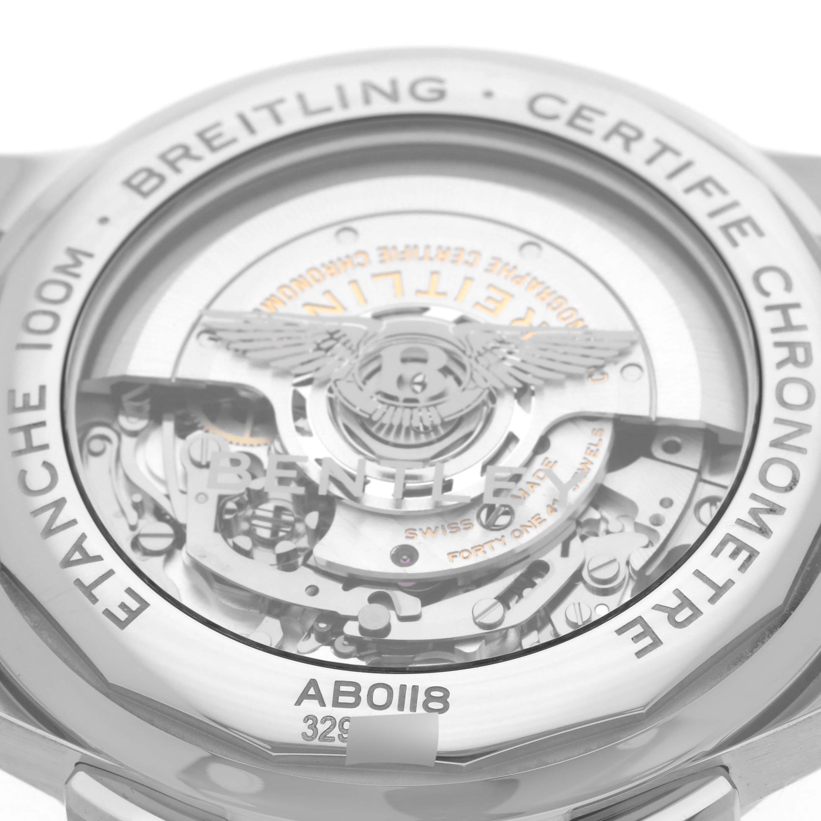 The image shows the back view of the Breitling Premier AB0118 Men's Stainless Steel Green Dial AB0118 Men's Stainless Steel Green Dial model, highlighting its internal mechanisms and engraving details.