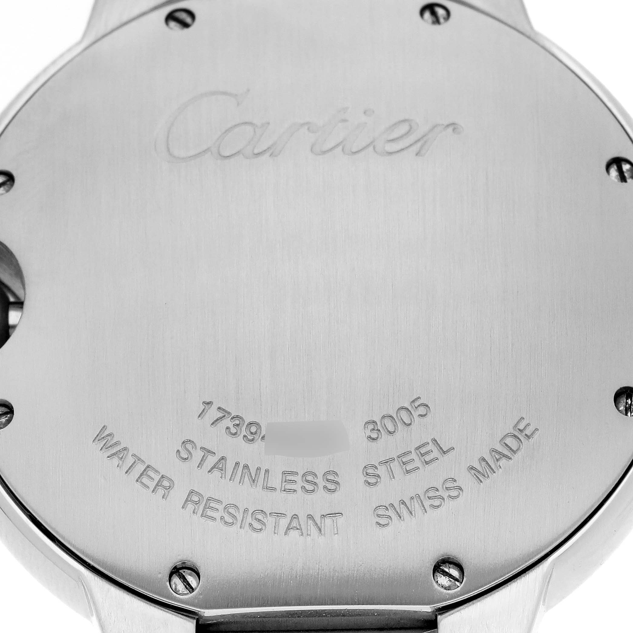 The image shows the back of a Cartier Ballon Bleu 62685 Men
s Stainless Steel Silver Dial 62685 Men
s Stainless Steel Silver Dial watch, highlighting the engraved text and screws.