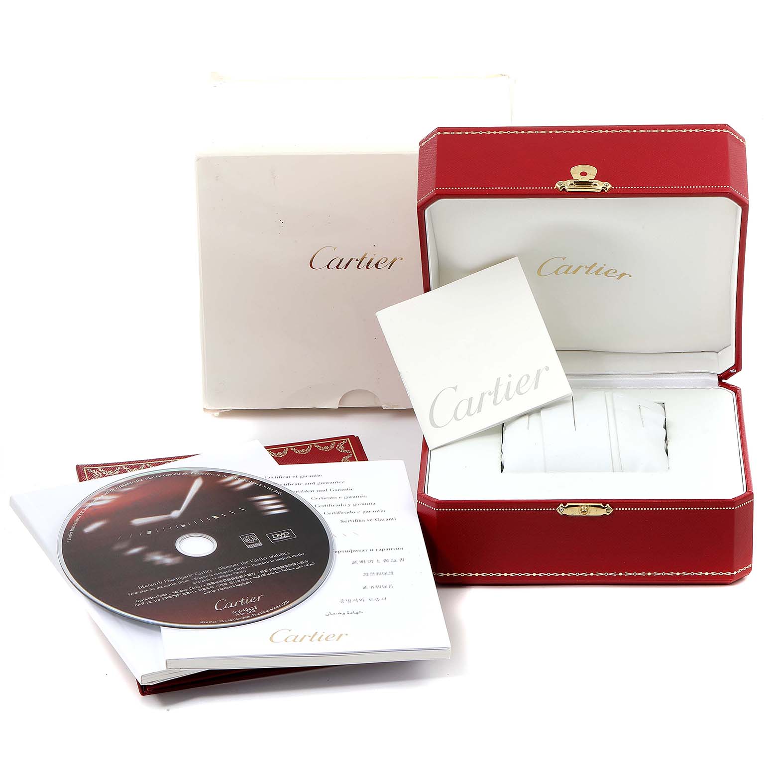 The image shows the packaging and accessories for the Calibre de Cartier watch by Cartier, including a red box, booklet, and CD.