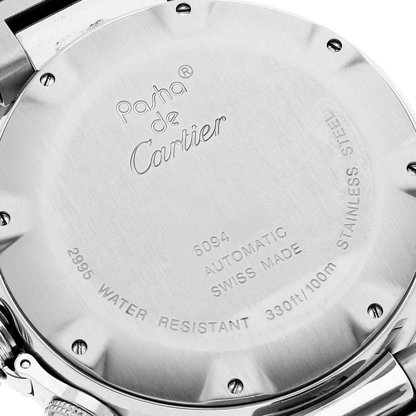 This image shows the back case of a Pasha de Cartier watch, highlighting its engravings and stainless steel material.