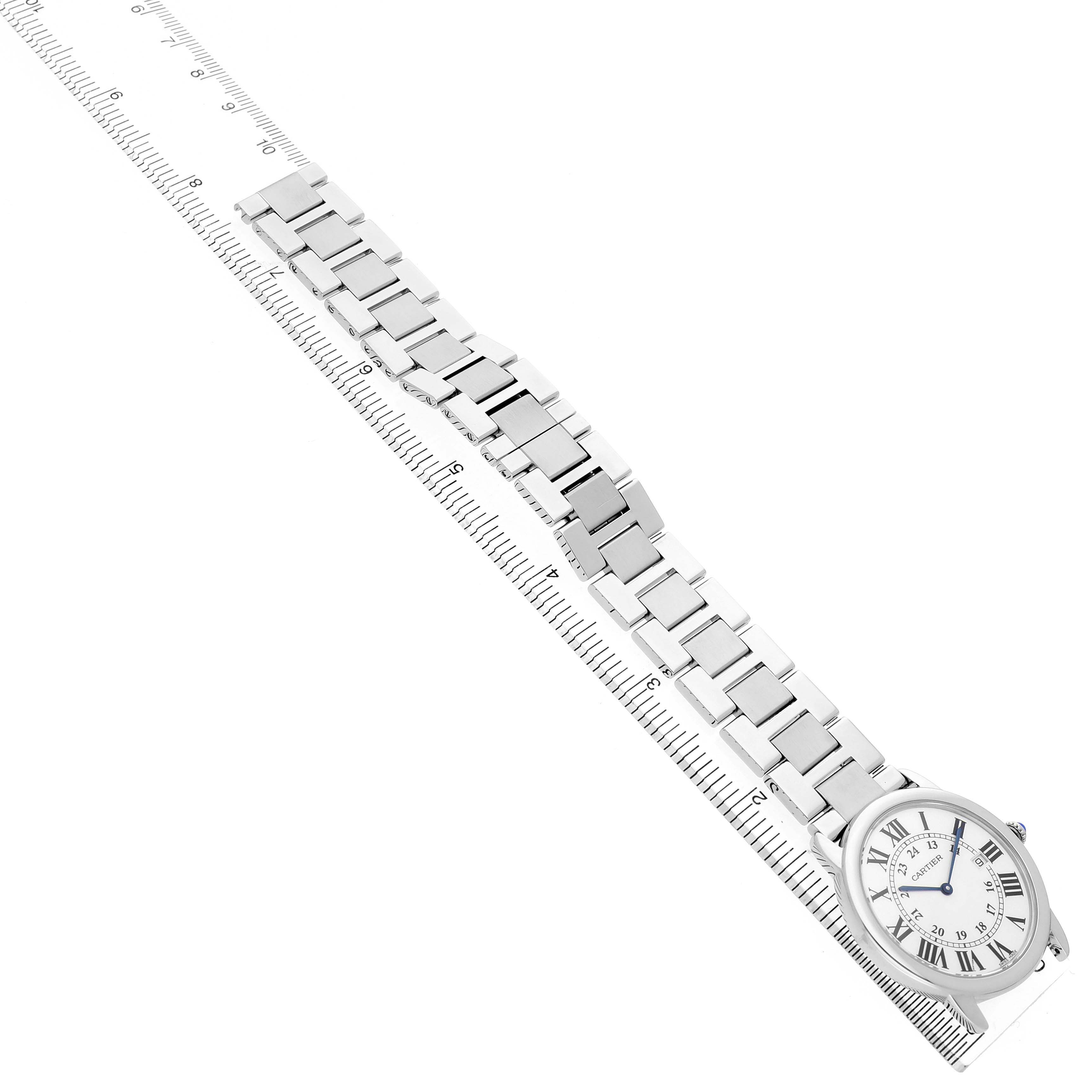 The Cartier Ronde W6701005 Men's Stainless Steel White Dial watch is shown from an overhead angle, displaying the full bracelet and face with Roman numerals.