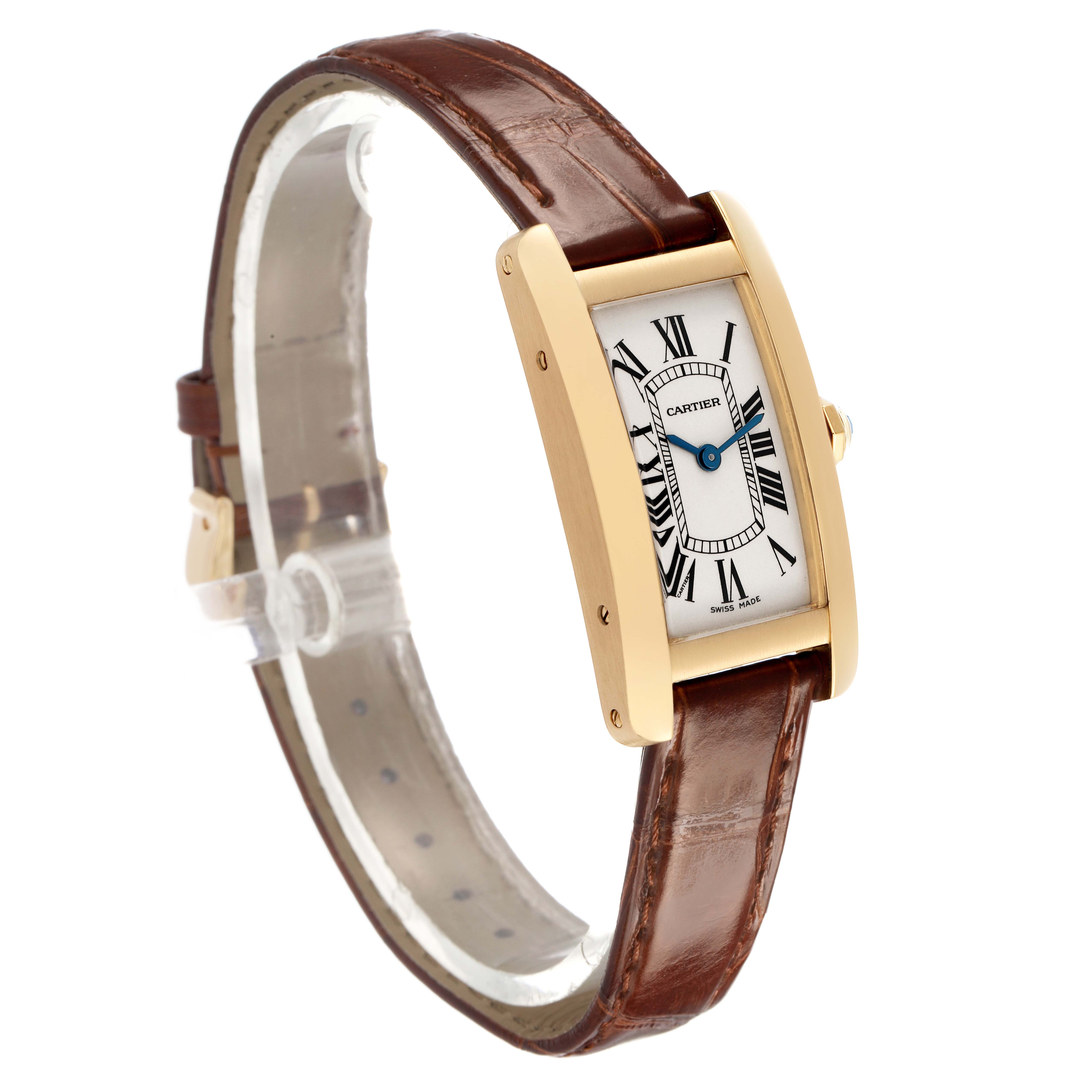The Cartier Tank Americaine W2601556 Women's Yellow Gold White Dial watch is shown at an angled side view, highlighting the rectangular case, crown, and leather strap.