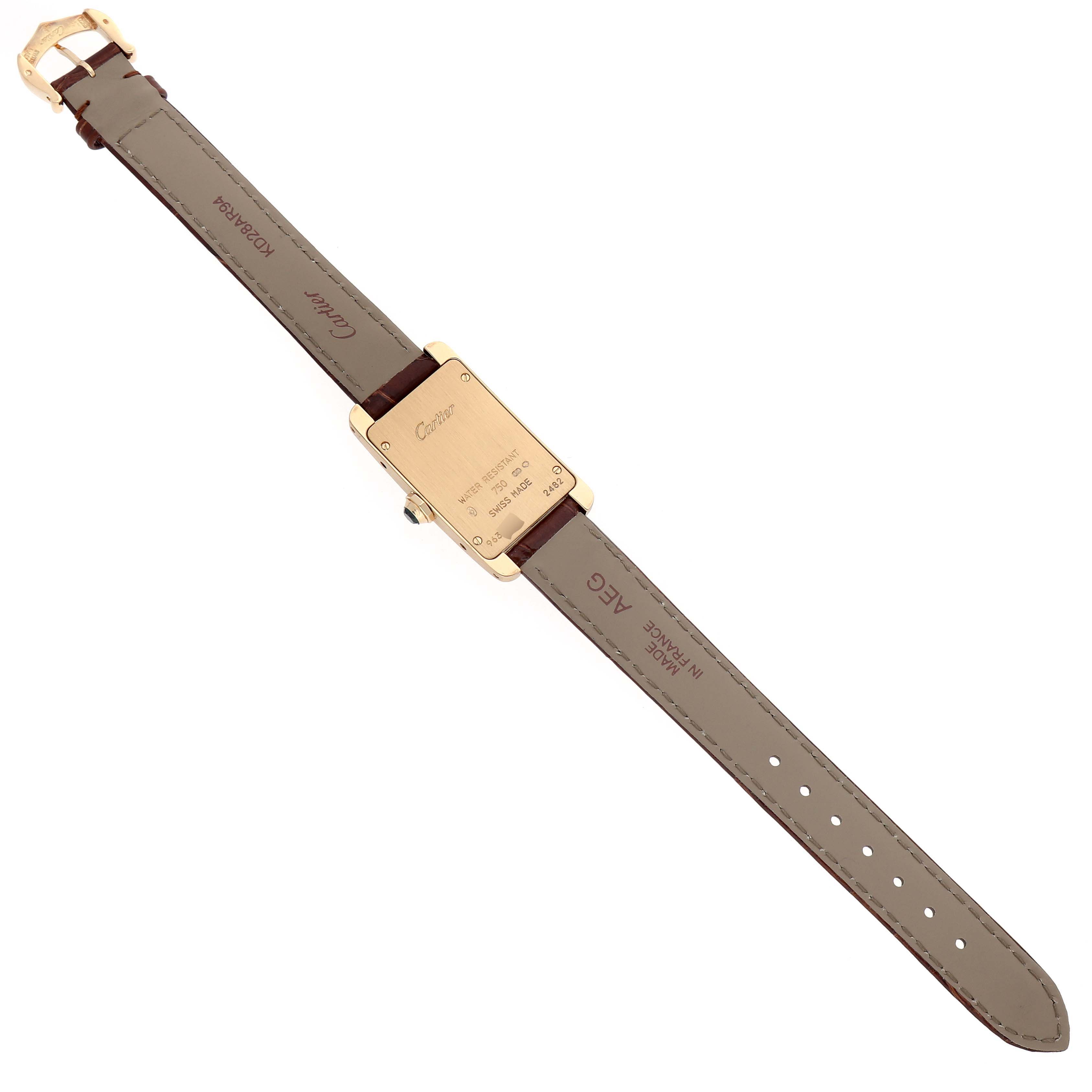The image shows the back view of a Cartier Tank Américaine watch, highlighting the case back and leather strap.