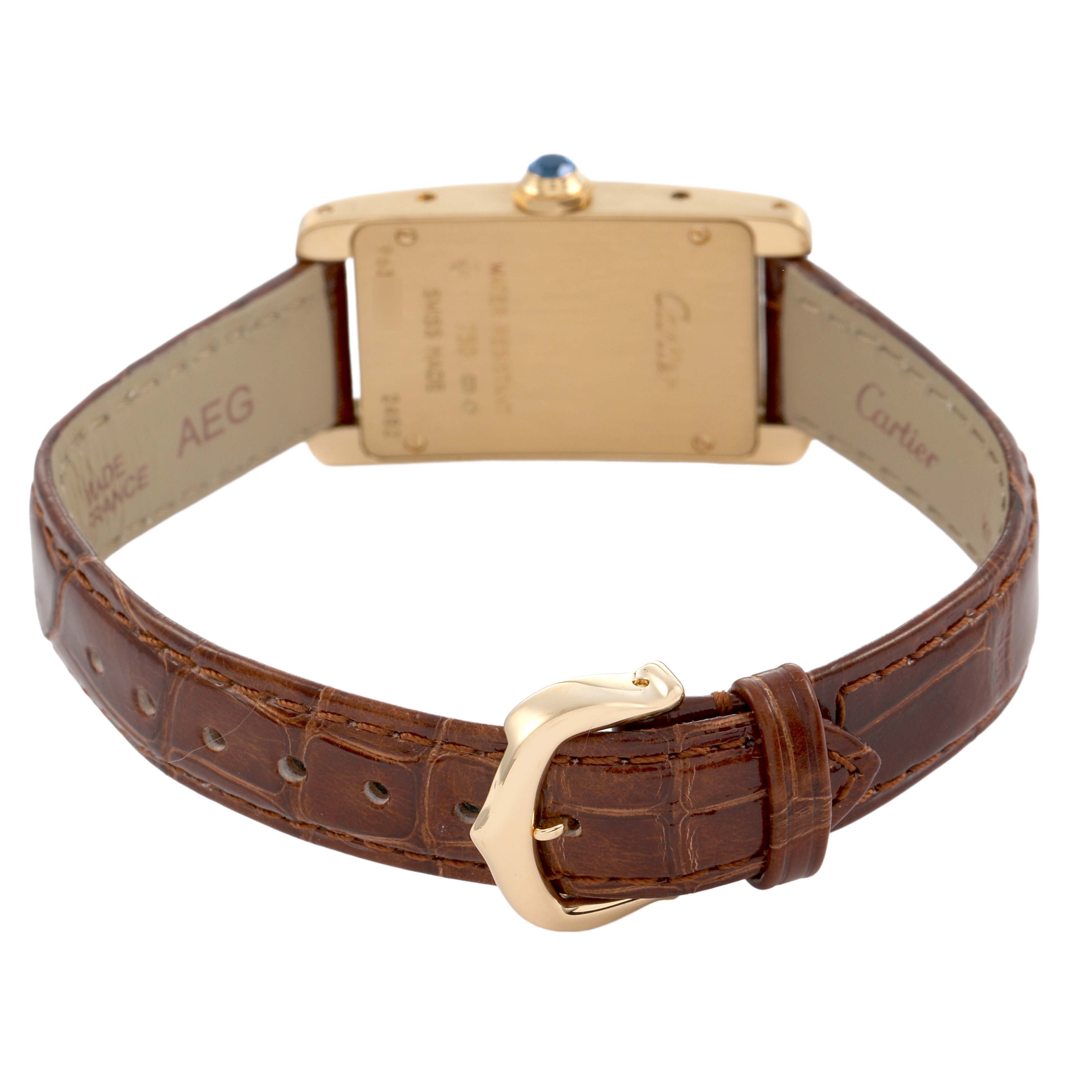 The Tank Americaine by Cartier is shown from the back, displaying its clasp and detailed strap.