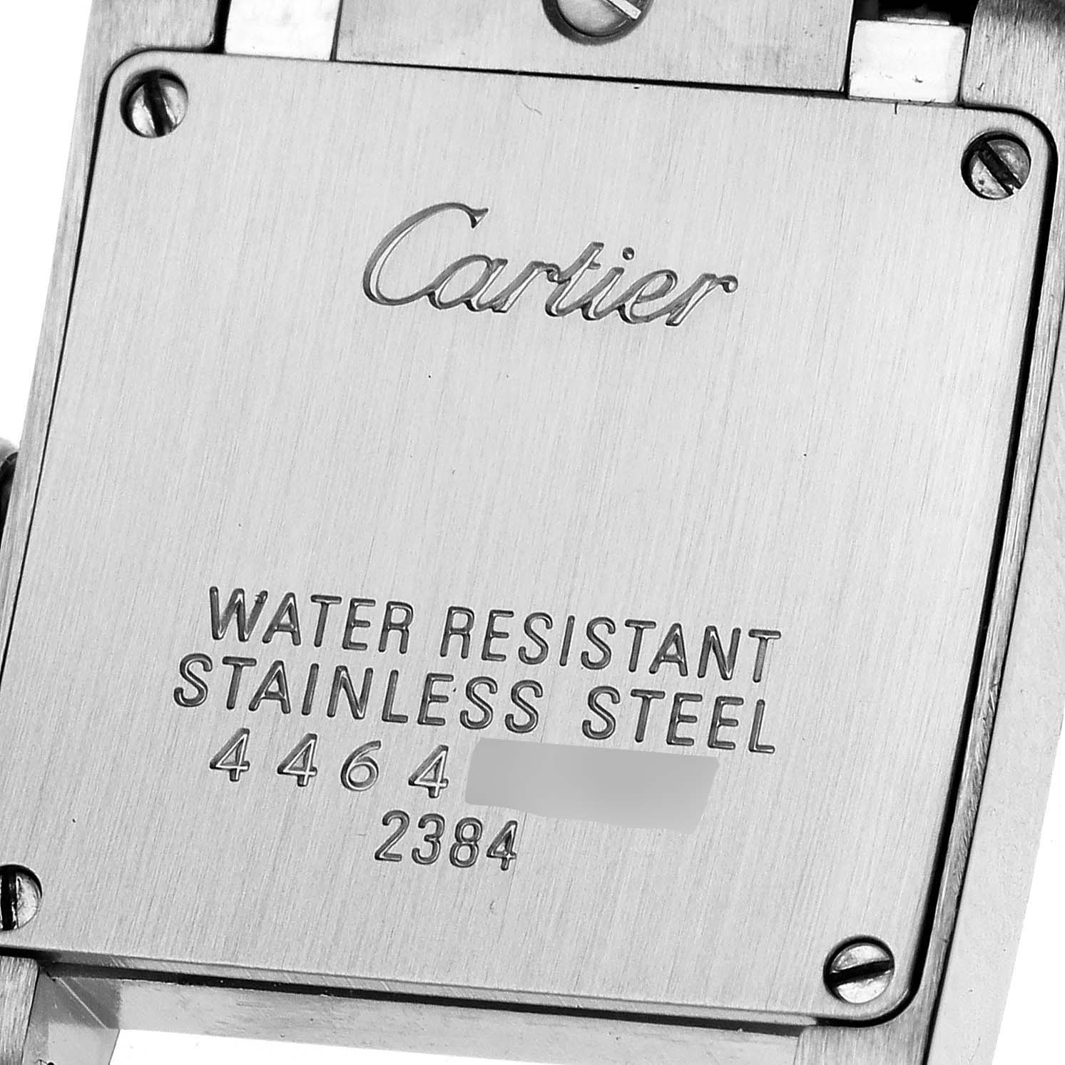 This image shows the back case of a Cartier Tank Francaise W51007Q4 Women's Steel and Gold (two tone) Silver Dial W51007Q4 Women's Steel and Gold (two tone) Silver Dial watch in a close-up angle, highlighting the model details and material.