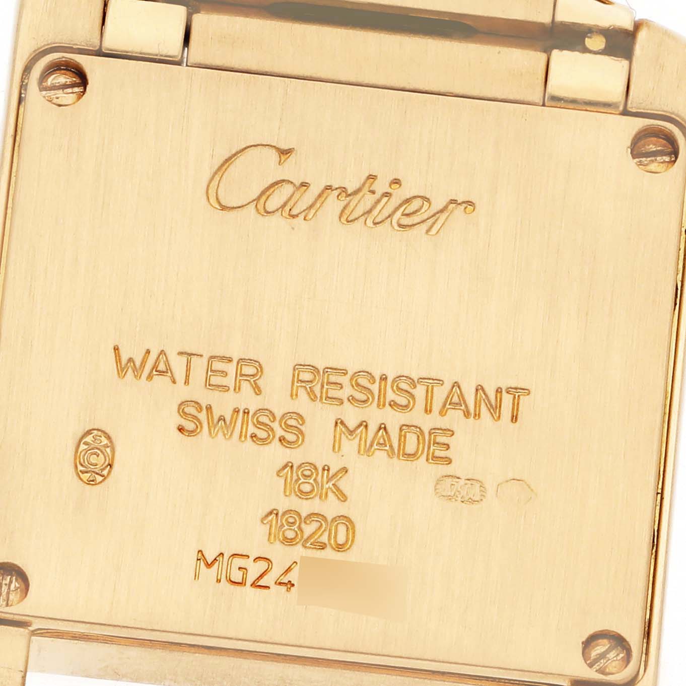 The image shows the back panel of the Cartier Tank Francaise W50002N2 Women's Yellow Gold Silver Dial W50002N2 Women's Yellow Gold Silver Dial watch, displaying engraved text and hallmark details.