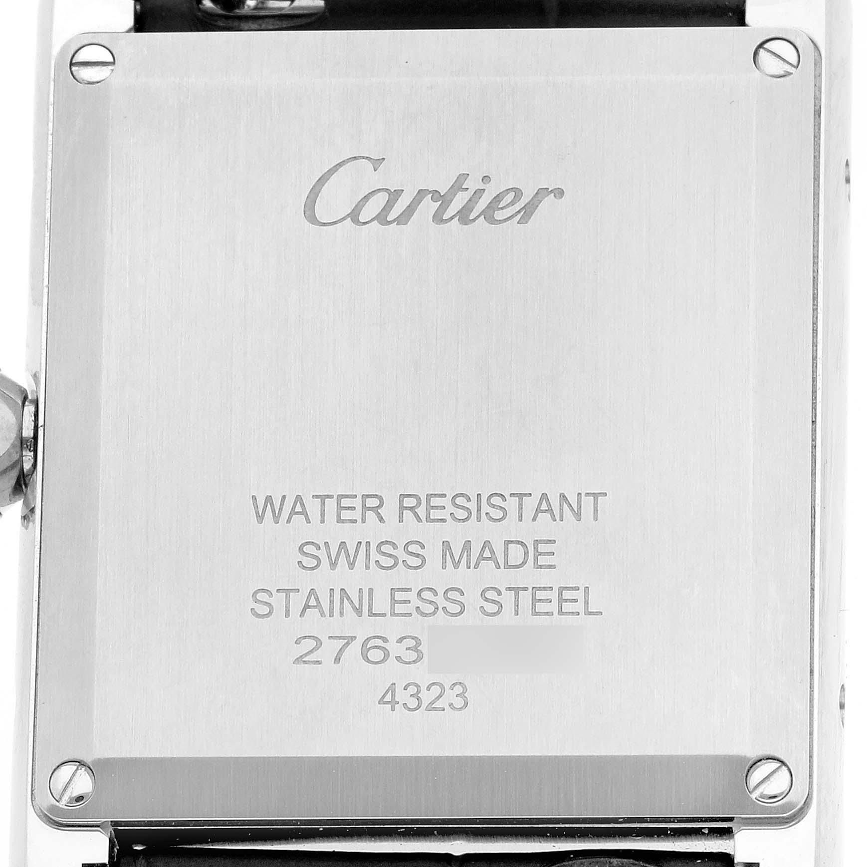 The image shows the back case of a Cartier Tank Must WSTA0055 Women's Stainless Steel Blue Dial watch, highlighting its branding and specifications.