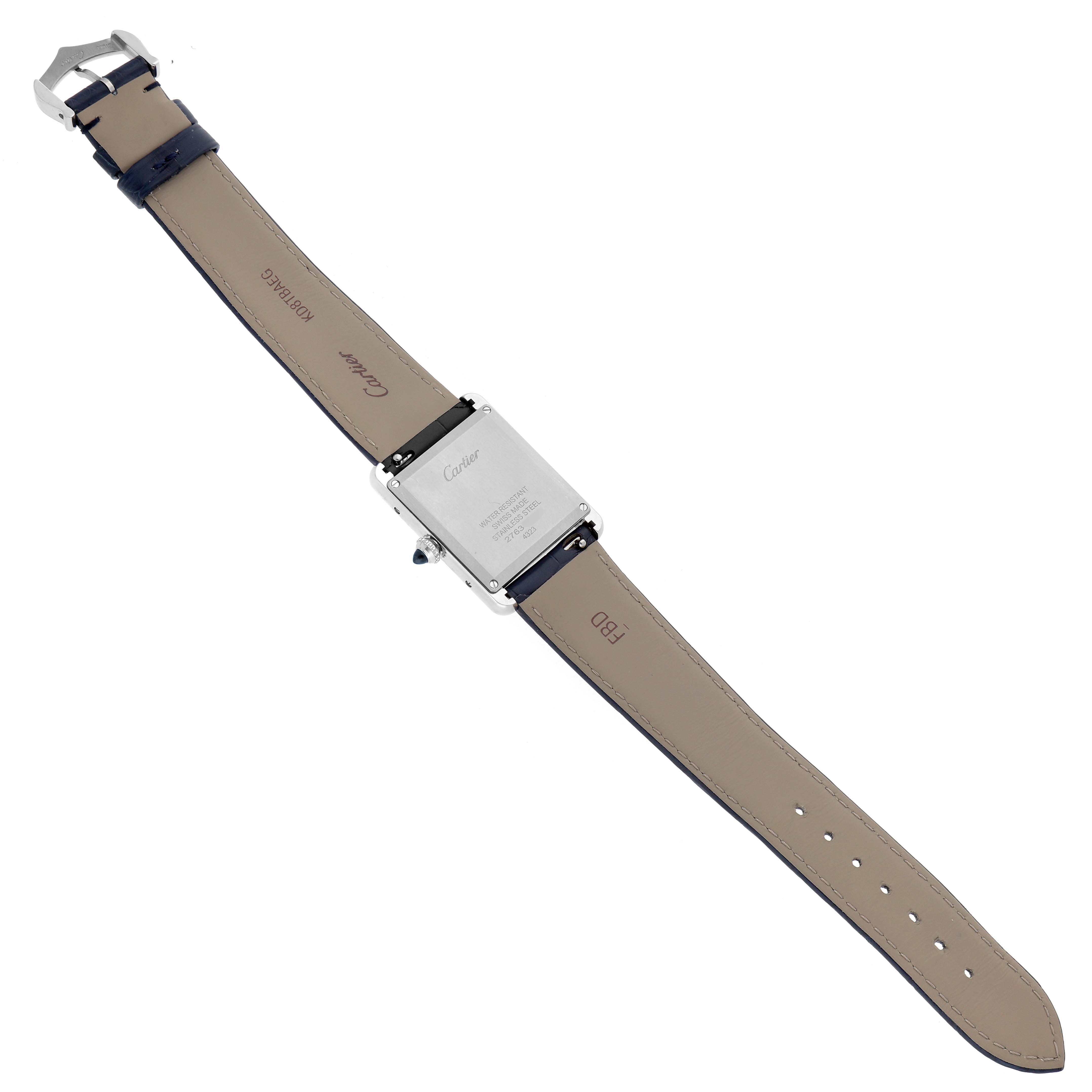 The Cartier Tank Must WSTA0055 Women's Stainless Steel Blue Dial watch is shown from the back, displaying the case back, leather straps, and clasp.