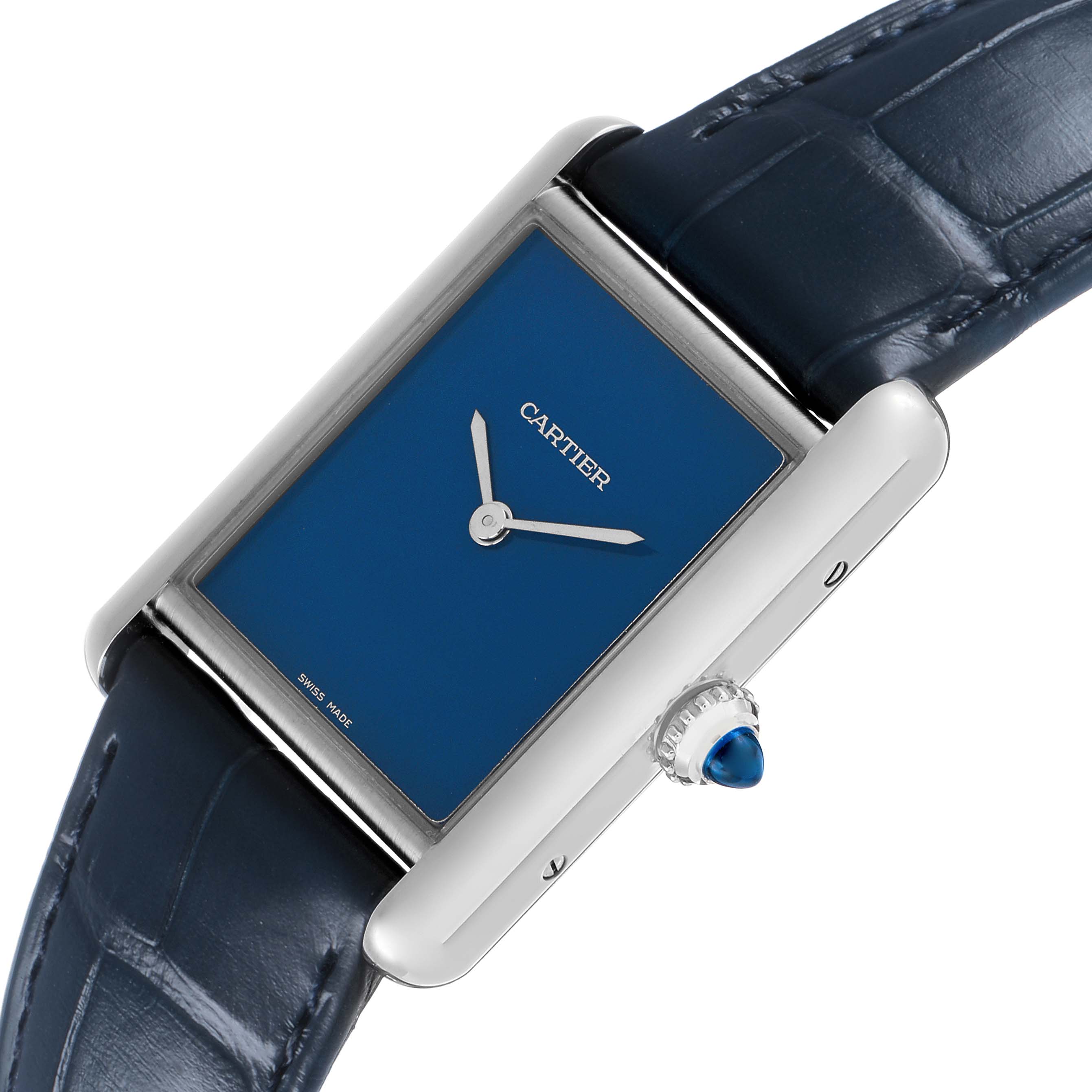 The Cartier Tank Must WSTA0055 Women's Stainless Steel Blue Dial watch is shown at an angle highlighting its blue dial, rectangular case, and dark blue leather strap.