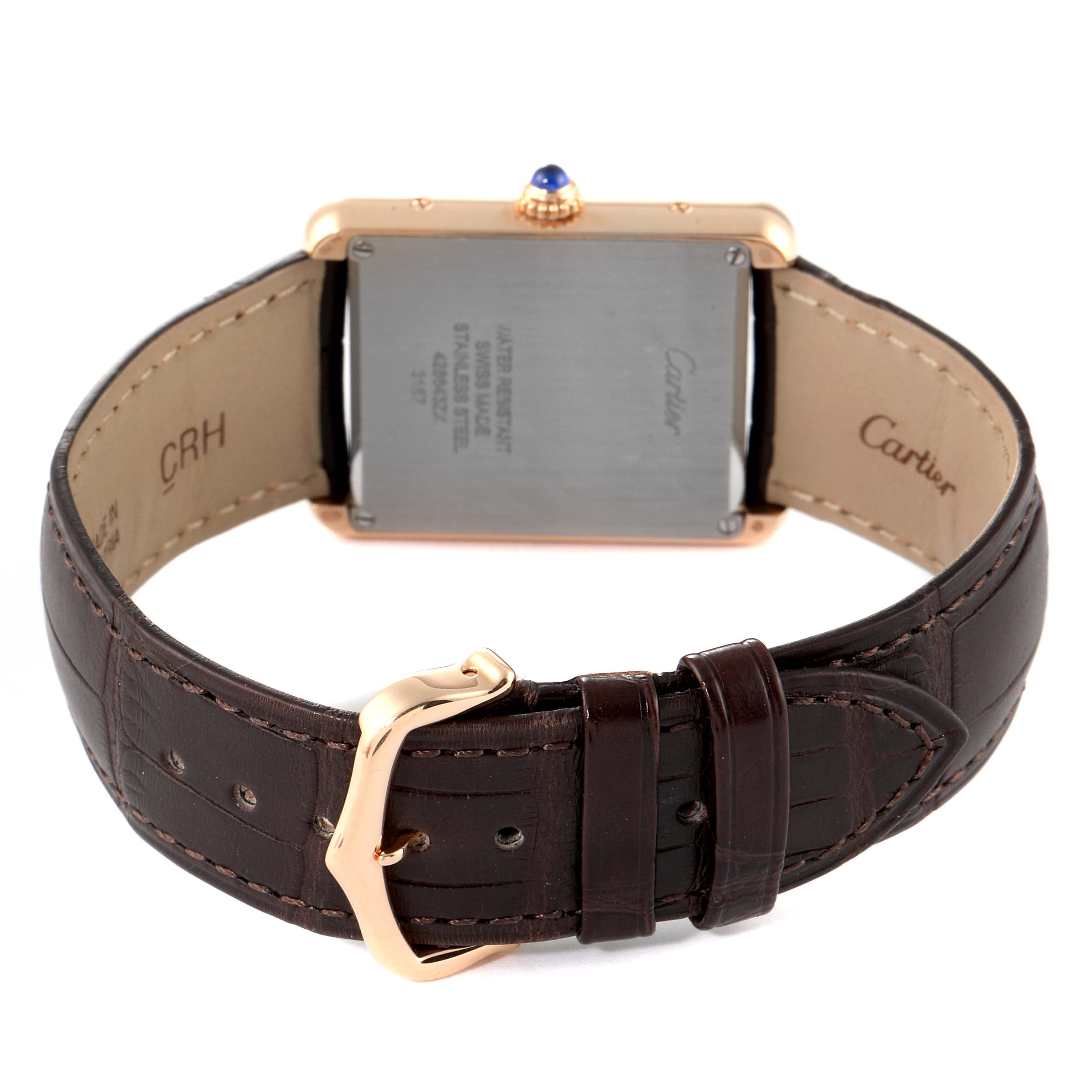 The image shows the back of the Cartier Tank Solo W5200025 Men's Rose Gold Silver Dial W5200025 Men's Rose Gold Silver Dial model watch, highlighting its clasp and brown leather strap.