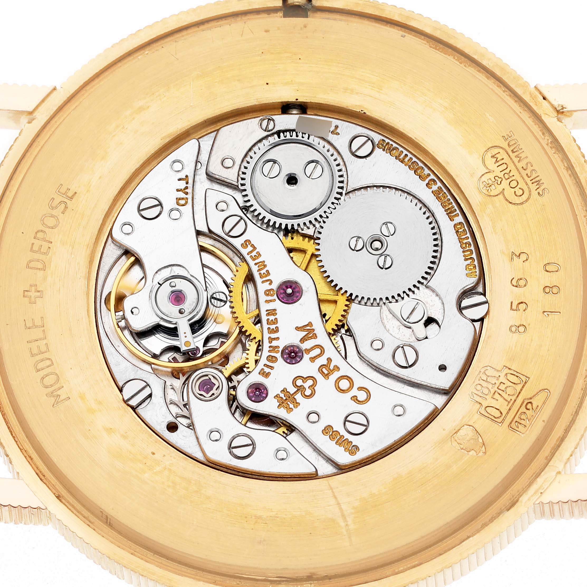 The image shows the back view of a Corum Coin Watch 4414556 Men
s Yellow Gold Champagne Dial 4414556 Men
s Yellow Gold Champagne Dial, highlighting its intricate internal movement mechanism.