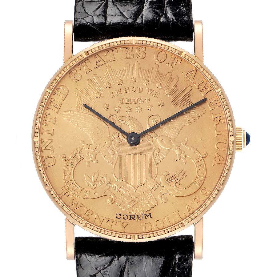The Corum Coin Watch model is shown from a front angle, highlighting its engraved dial and black leather strap.
