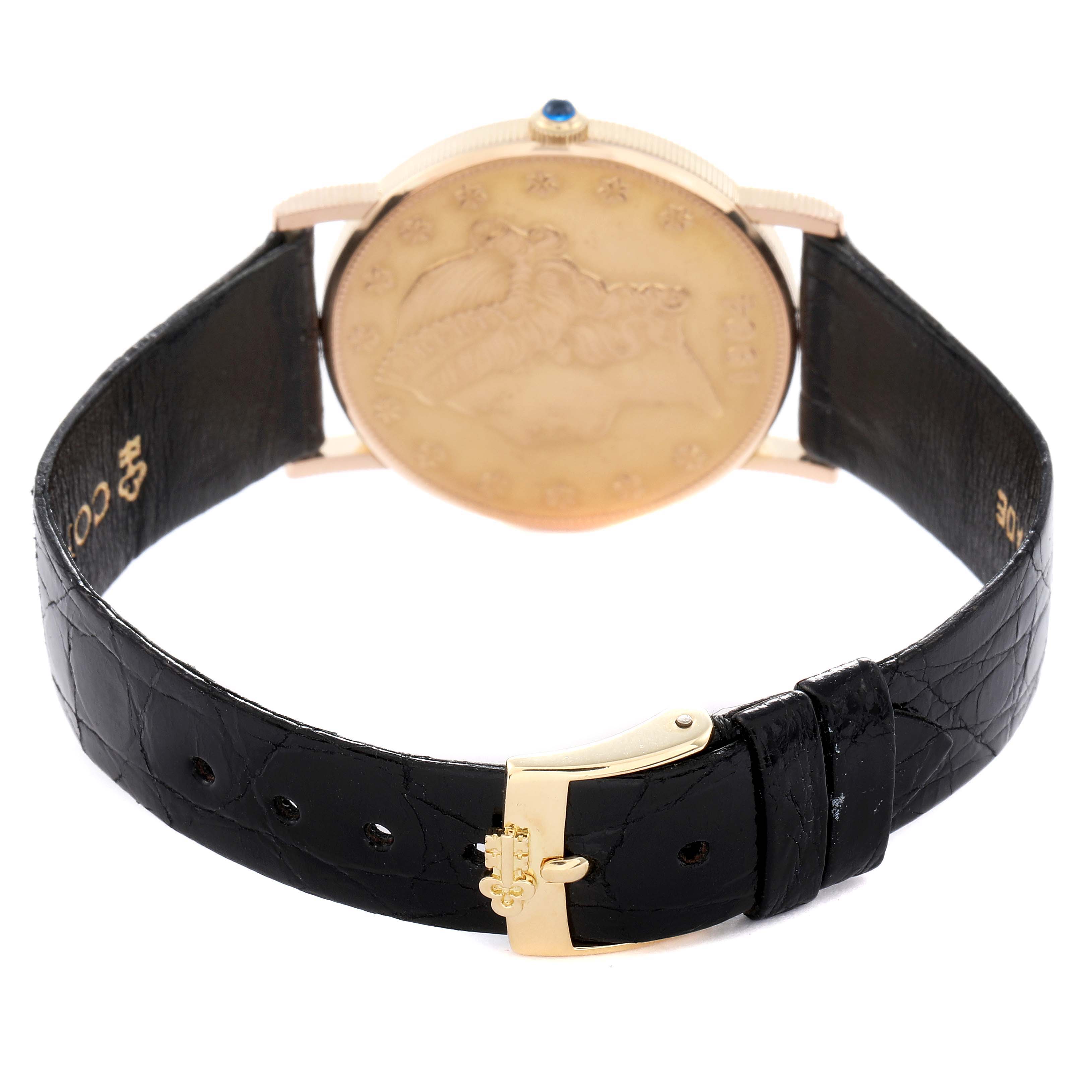 The image shows the back angle of the Corum Coin Watch 4414556 Men
s Yellow Gold Champagne Dial 4414556 Men
s Yellow Gold Champagne Dial, displaying its case, crown, and black leather strap with a buckle.