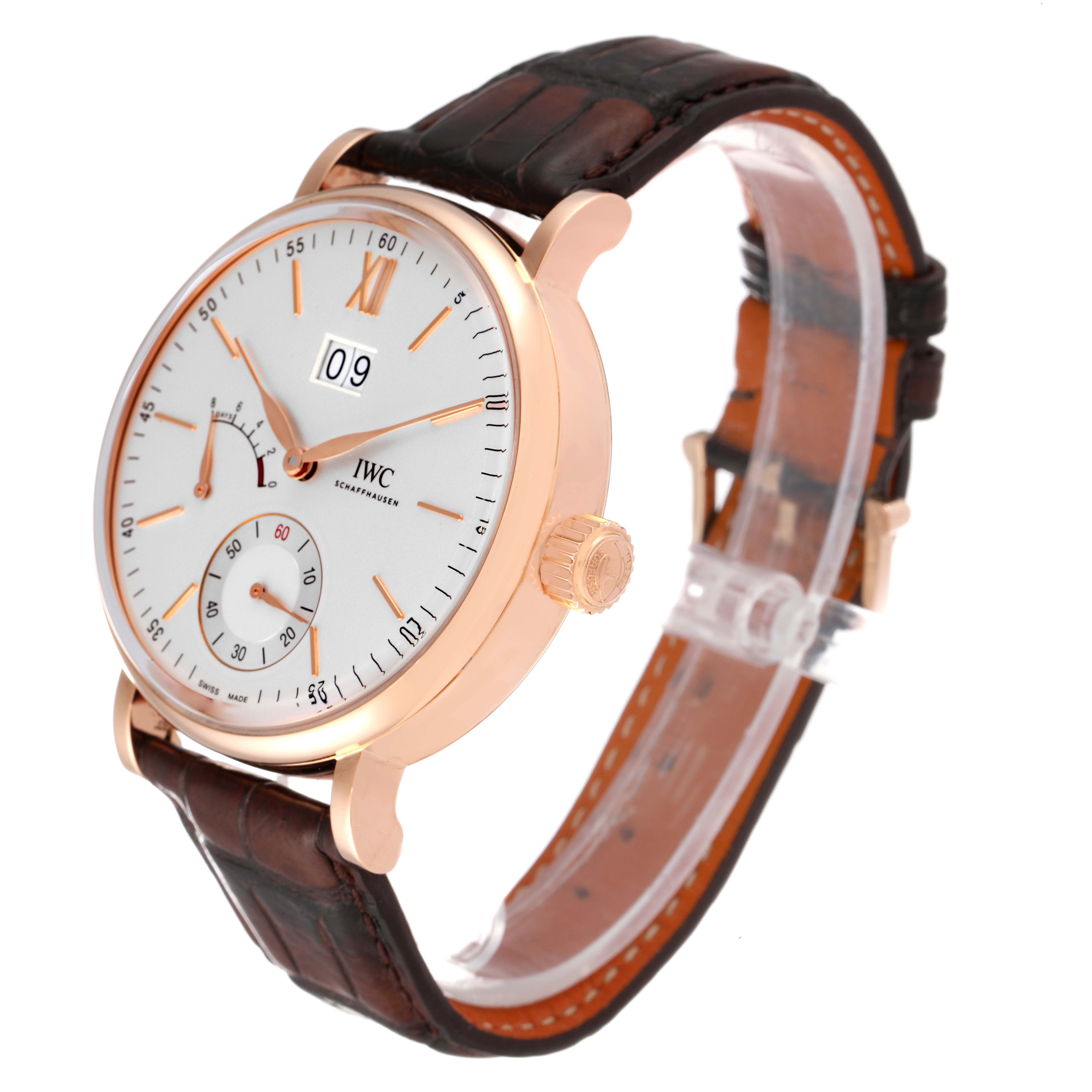 The image shows an angled view of the IWC Portofino IW516102 Men's Rose Gold Silver Dial IW516102 Men's Rose Gold Silver Dial watch, highlighting its dial, crown, and leather strap.