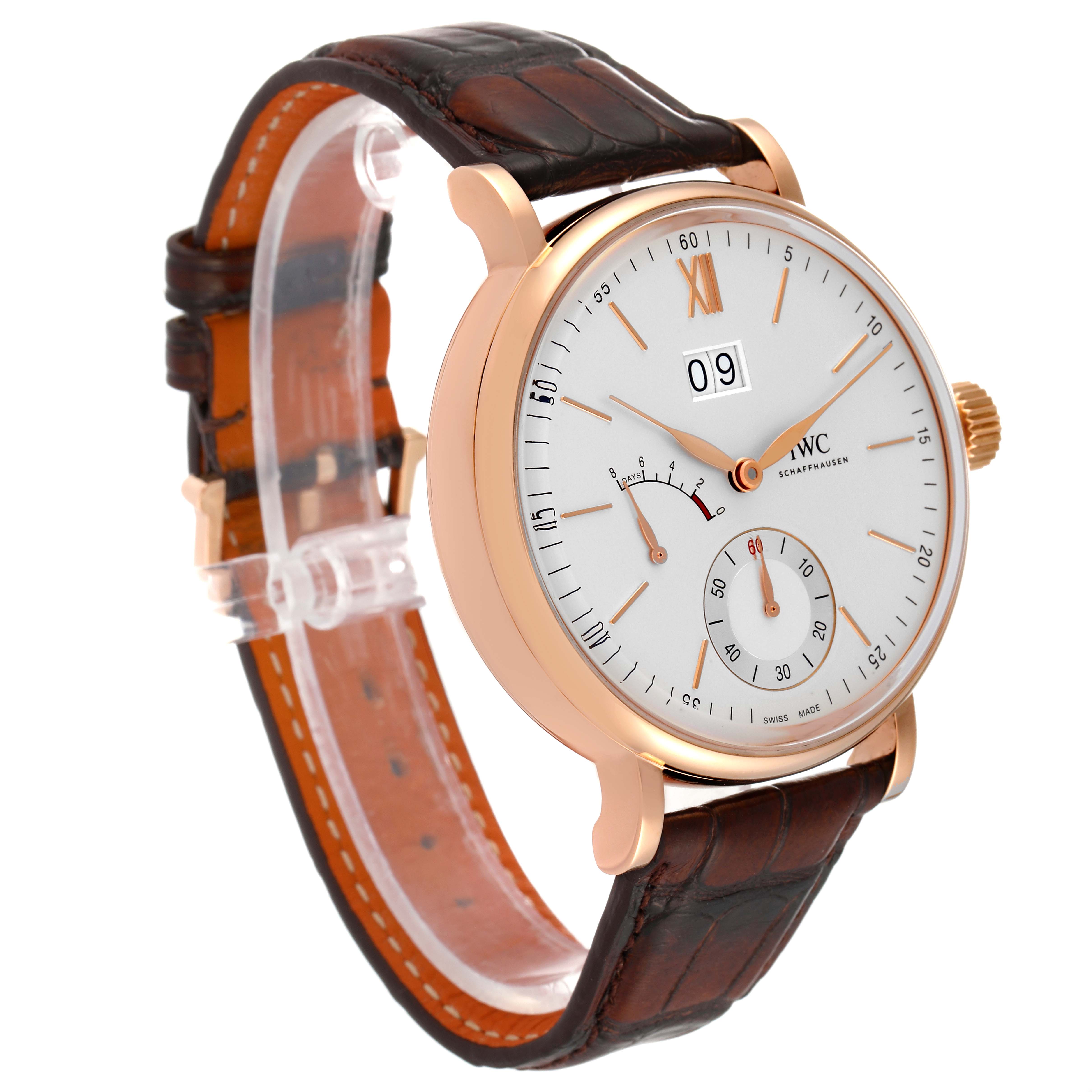 This IWC Portofino IW516102 Men's Rose Gold Silver Dial IW516102 Men's Rose Gold Silver Dial watch is shown at an angle highlighting its face, gold case, crown, and brown leather strap.