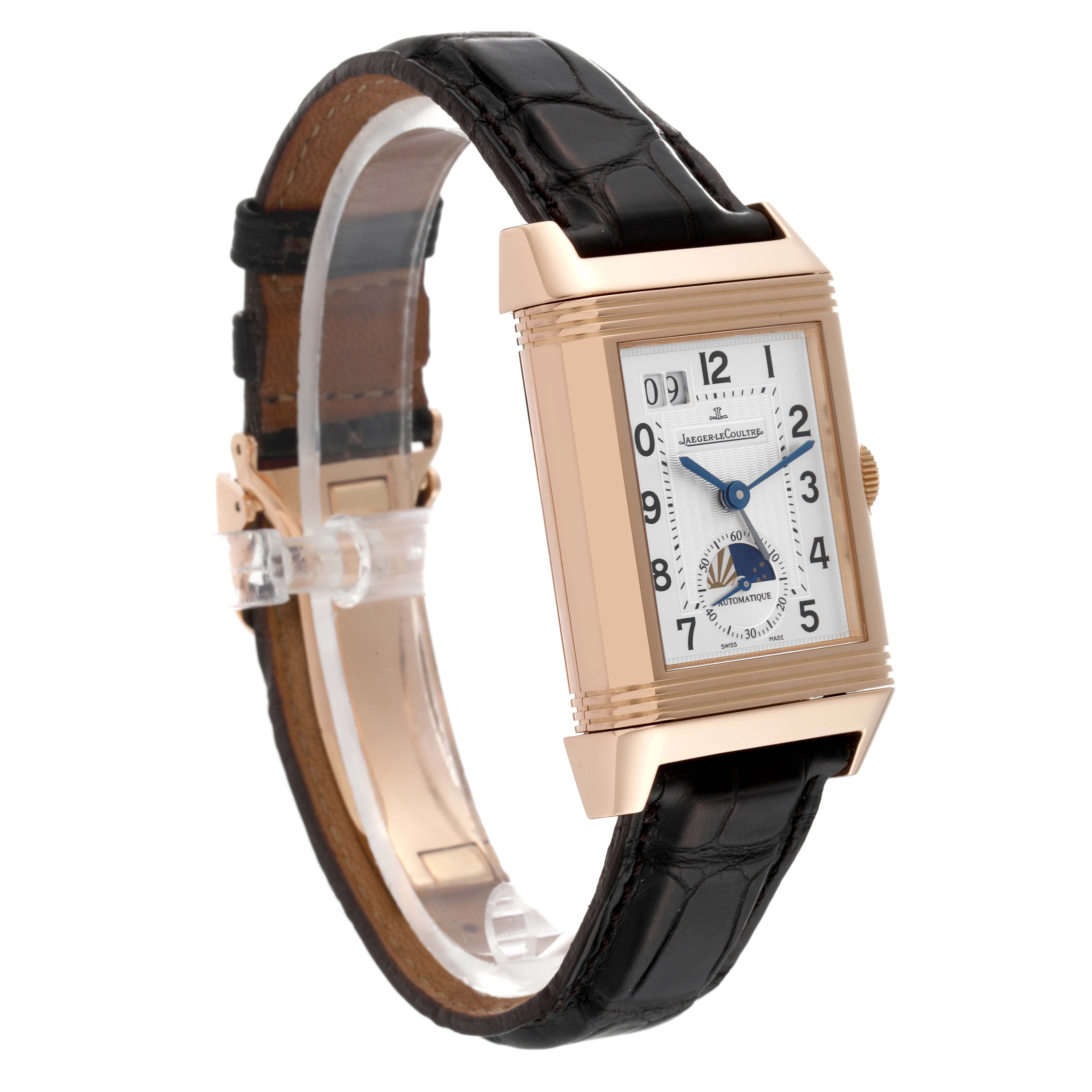 The image depicts a Jaeger-LeCoultre Reverso watch angled to show the front dial and leather strap.