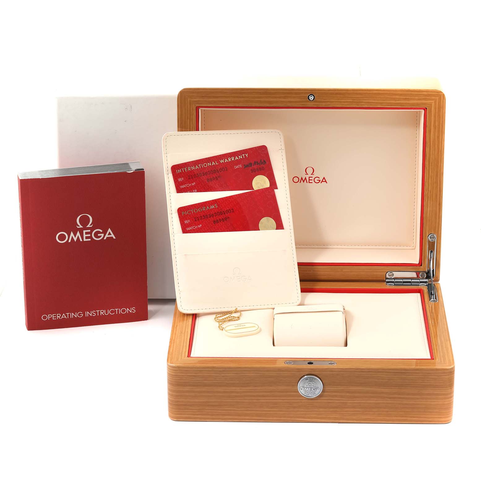 The image shows the packaging and accessories of an Omega Seamaster 212.30.36.20.01.002 Men
s Stainless Steel Black Dial 212.30.36.20.01.002 Men
s Stainless Steel Black Dial watch, including the box, warranty cards, and operating instructions.