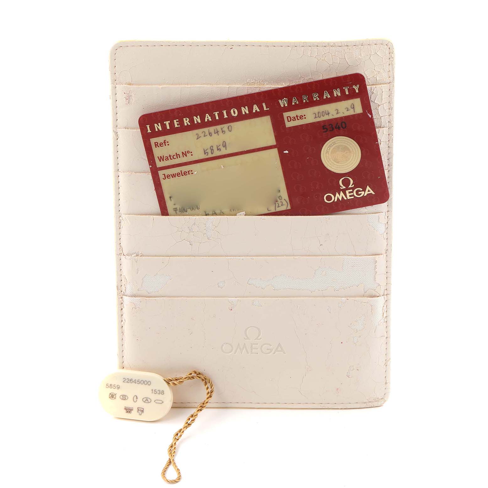 The image shows an Omega Seamaster 2264.50.00 Men
s Stainless Steel Black Dial 2264.50.00 Men
s Stainless Steel Black Dial warranty card and tag along with a white cardholder.