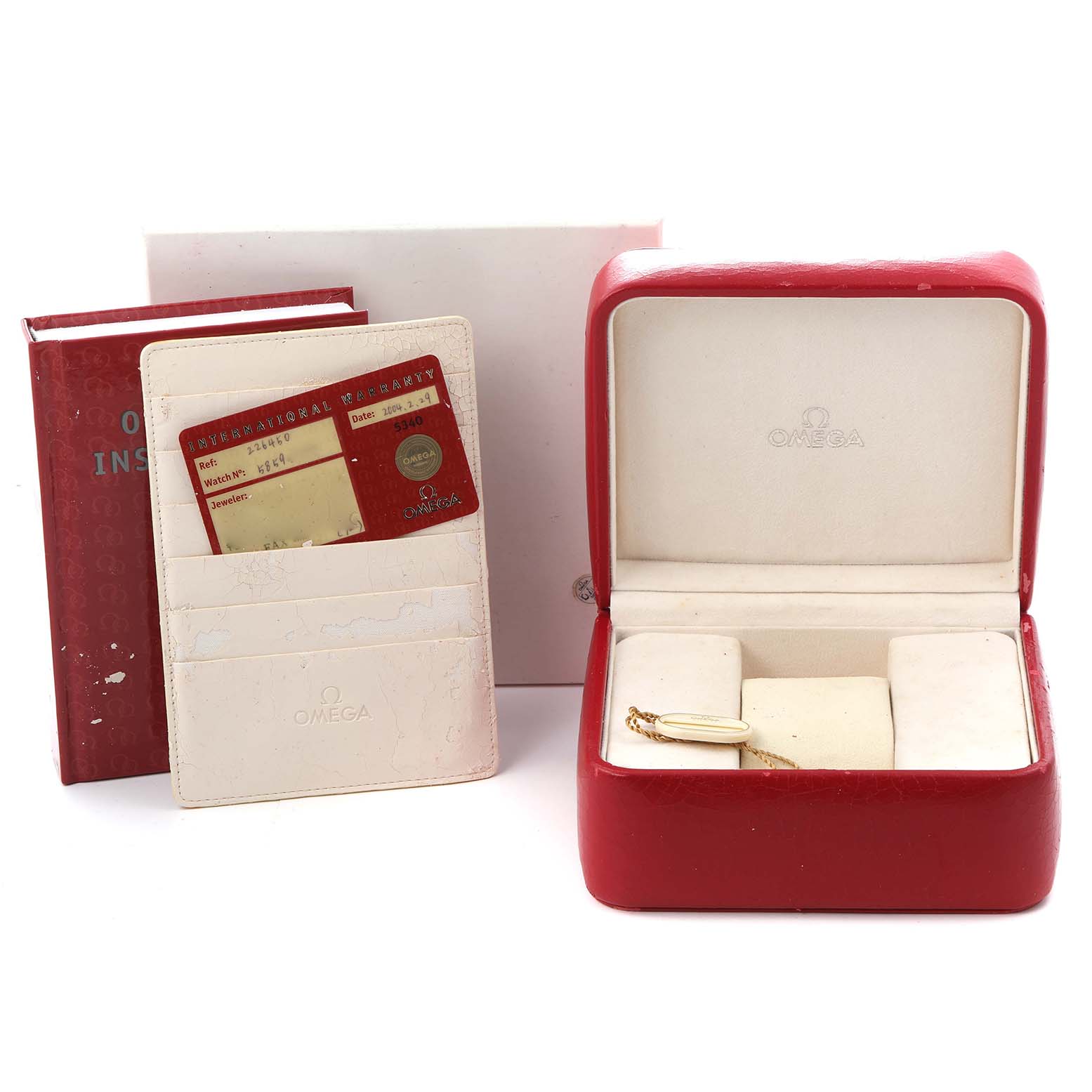 The image shows the Omega Seamaster 2264.50.00 Men
s Stainless Steel Black Dial 2264.50.00 Men
s Stainless Steel Black Dial watch box, warranty cards, and instruction manual, angled to display all accessories.